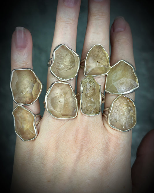 Genuine Libyan Desert Glass sterling silver ring featuring ancient impact glass with luminous golden tones. One of a kind by Become Spellbound, Baltimore Magazine Best of Baltimore 2026 Jewelry winner.