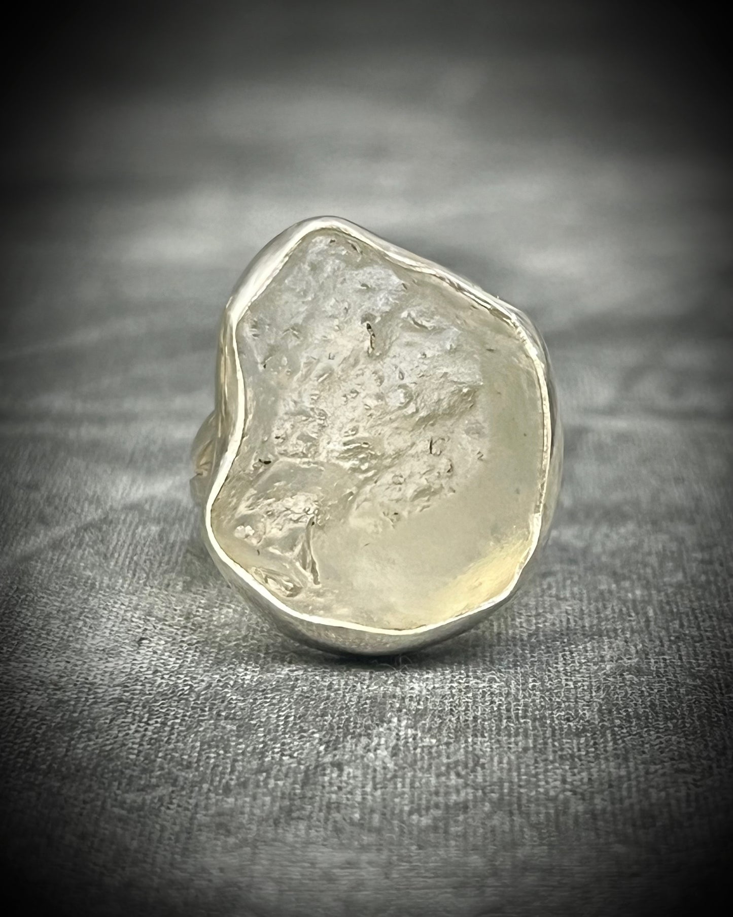 Genuine Libyan Desert Glass sterling silver ring featuring ancient impact glass with luminous golden tones. One of a kind by Become Spellbound, Baltimore Magazine Best of Baltimore 2026 Jewelry winner.