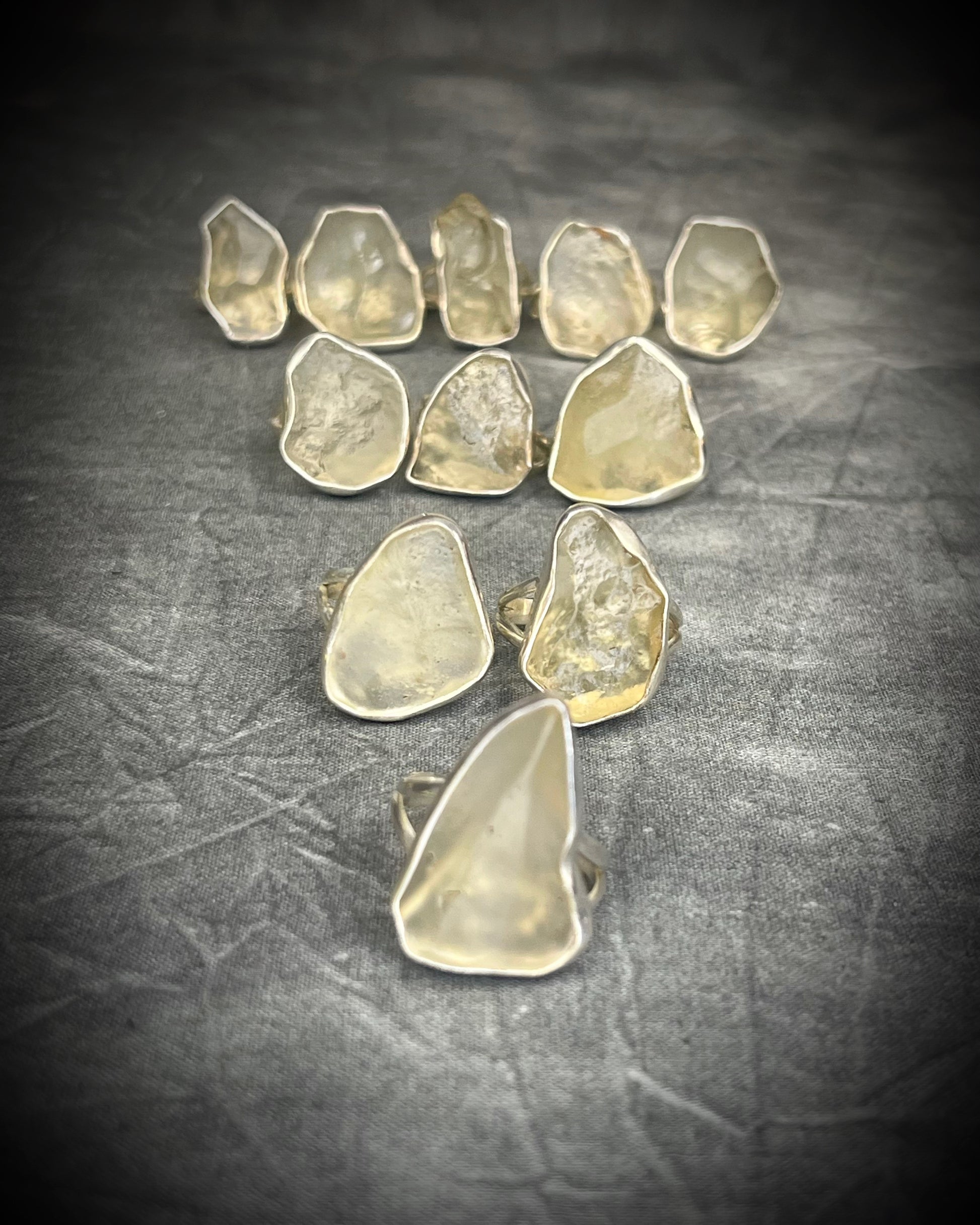 Genuine Libyan Desert Glass sterling silver ring featuring ancient impact glass with luminous golden tones. One of a kind by Become Spellbound, Baltimore Magazine Best of Baltimore 2026 Jewelry winner.