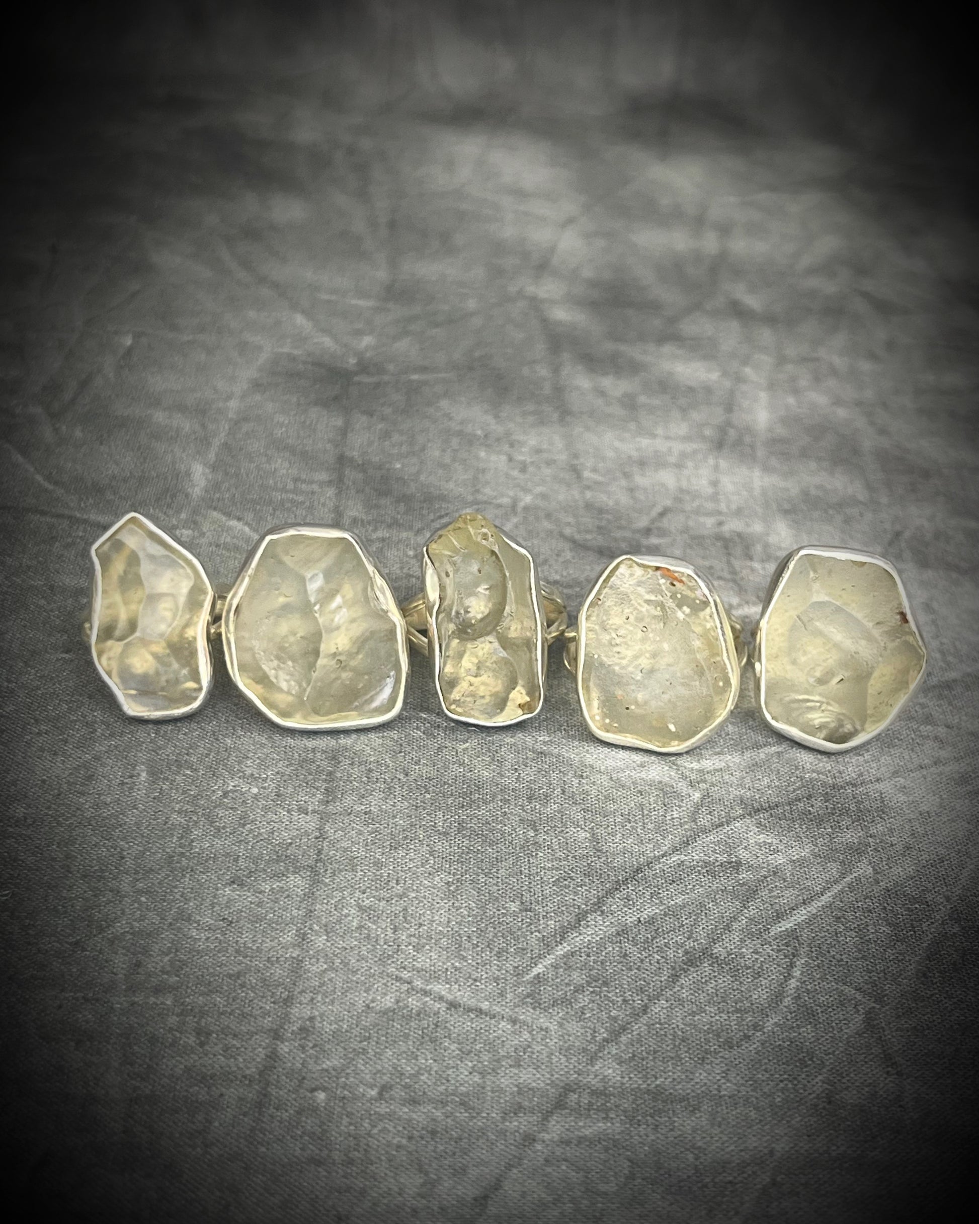 Genuine Libyan Desert Glass sterling silver ring featuring ancient impact glass with luminous golden tones. One of a kind by Become Spellbound, Baltimore Magazine Best of Baltimore 2026 Jewelry winner.