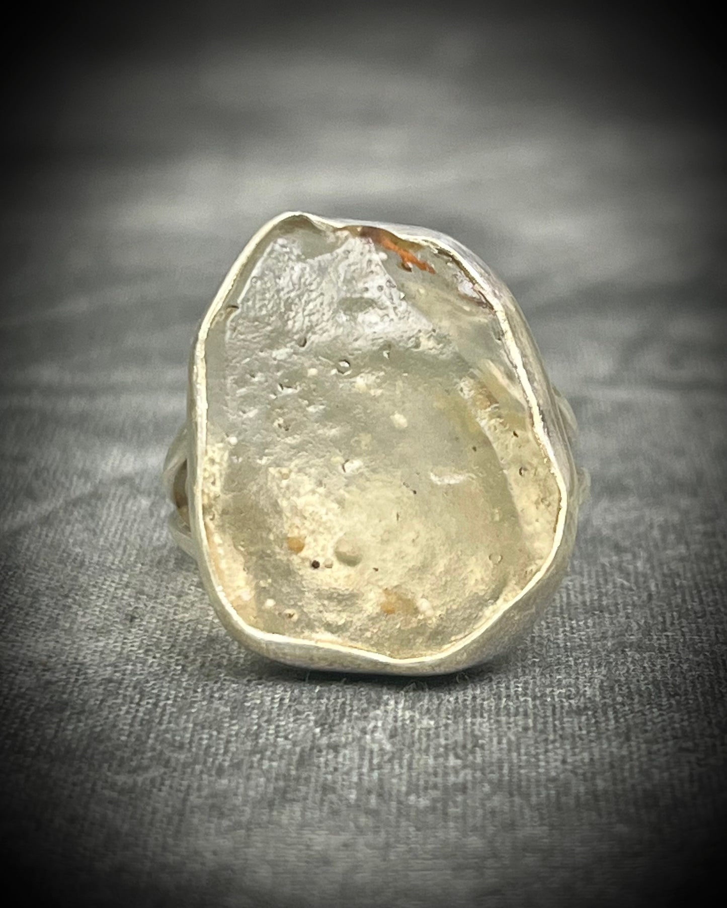 Genuine Libyan Desert Glass sterling silver ring featuring ancient impact glass with luminous golden tones. One of a kind by Become Spellbound, Baltimore Magazine Best of Baltimore 2026 Jewelry winner.
