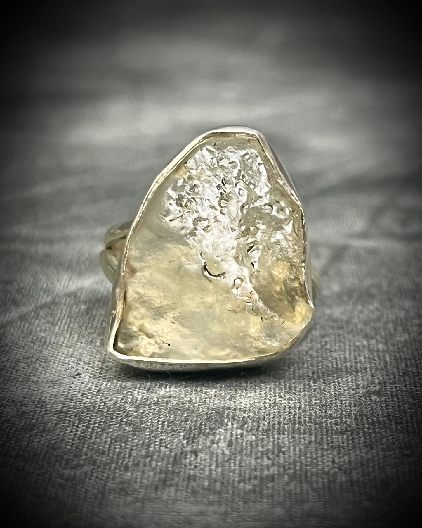 Genuine Libyan Desert Glass sterling silver ring featuring ancient impact glass with luminous golden tones. One of a kind by Become Spellbound, Baltimore Magazine Best of Baltimore 2026 Jewelry winner.