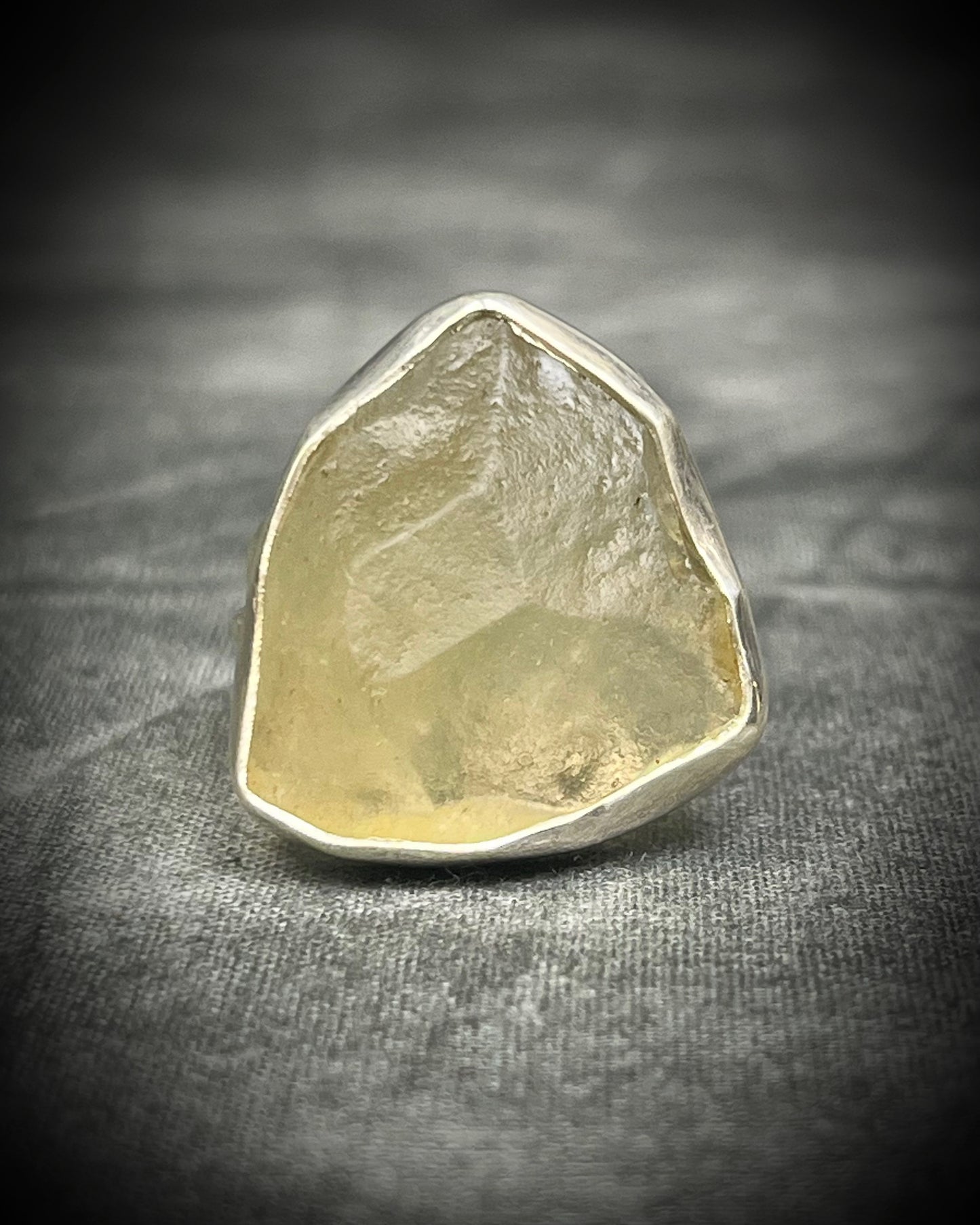 Genuine Libyan Desert Glass sterling silver ring featuring ancient impact glass with luminous golden tones. One of a kind by Become Spellbound, Baltimore Magazine Best of Baltimore 2026 Jewelry winner.