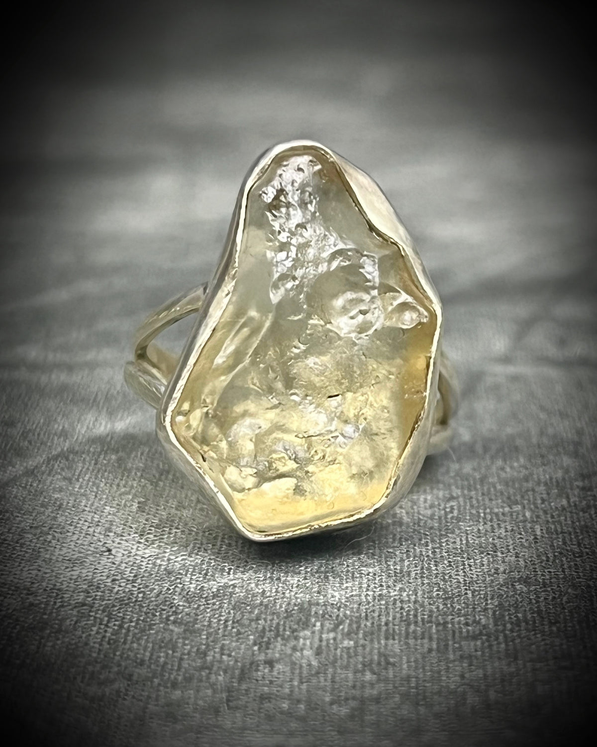 Genuine Libyan Desert Glass sterling silver ring featuring ancient impact glass with luminous golden tones. One of a kind by Become Spellbound, Baltimore Magazine Best of Baltimore 2026 Jewelry winner.