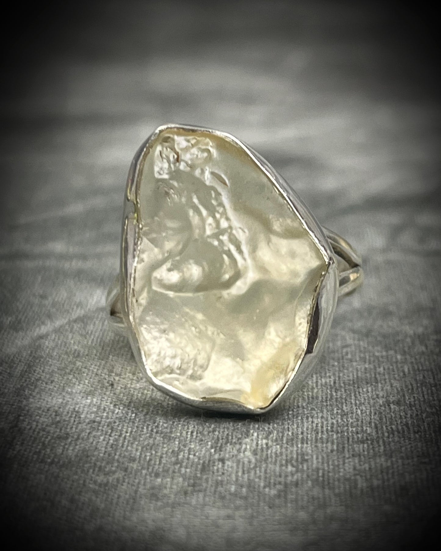 Genuine Libyan Desert Glass sterling silver ring featuring ancient impact glass with luminous golden tones. One of a kind by Become Spellbound, Baltimore Magazine Best of Baltimore 2026 Jewelry winner.