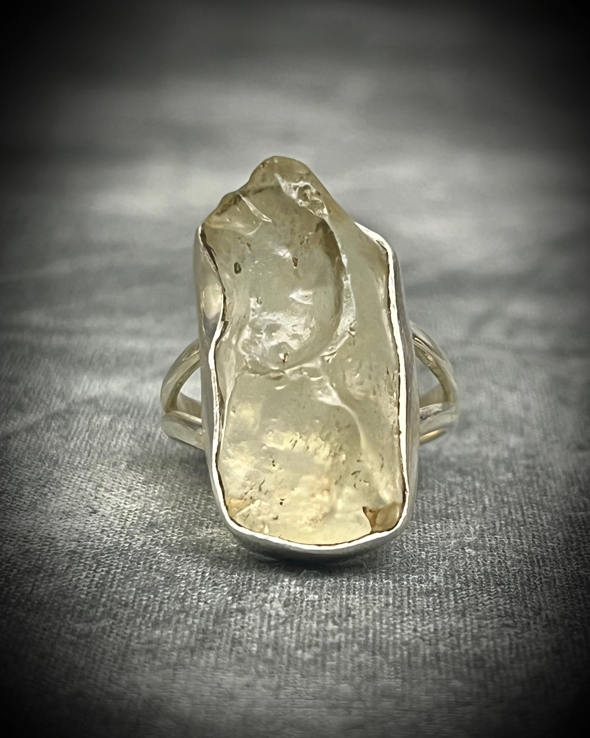 Genuine Libyan Desert Glass sterling silver ring featuring ancient impact glass with luminous golden tones. One of a kind by Become Spellbound, Baltimore Magazine Best of Baltimore 2026 Jewelry winner.