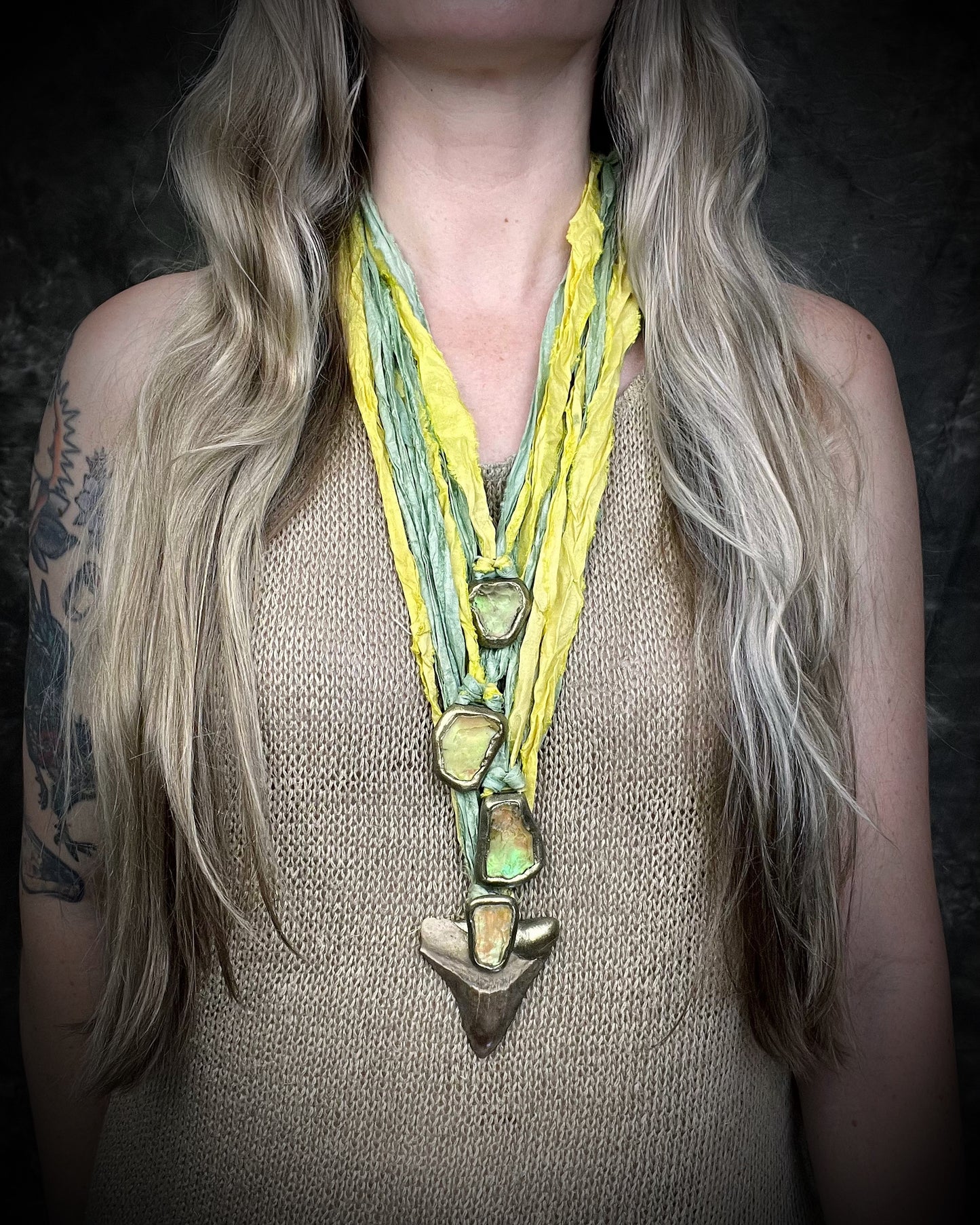 Genuine Megalodon fossil shark tooth talisman with Libyan Desert Glass and mint green and yellow recycled silk ties, layered here with more tektite pendants by Become Spellbound, Baltimore Magazine Best of Baltimore 2026 Jewelry winner.