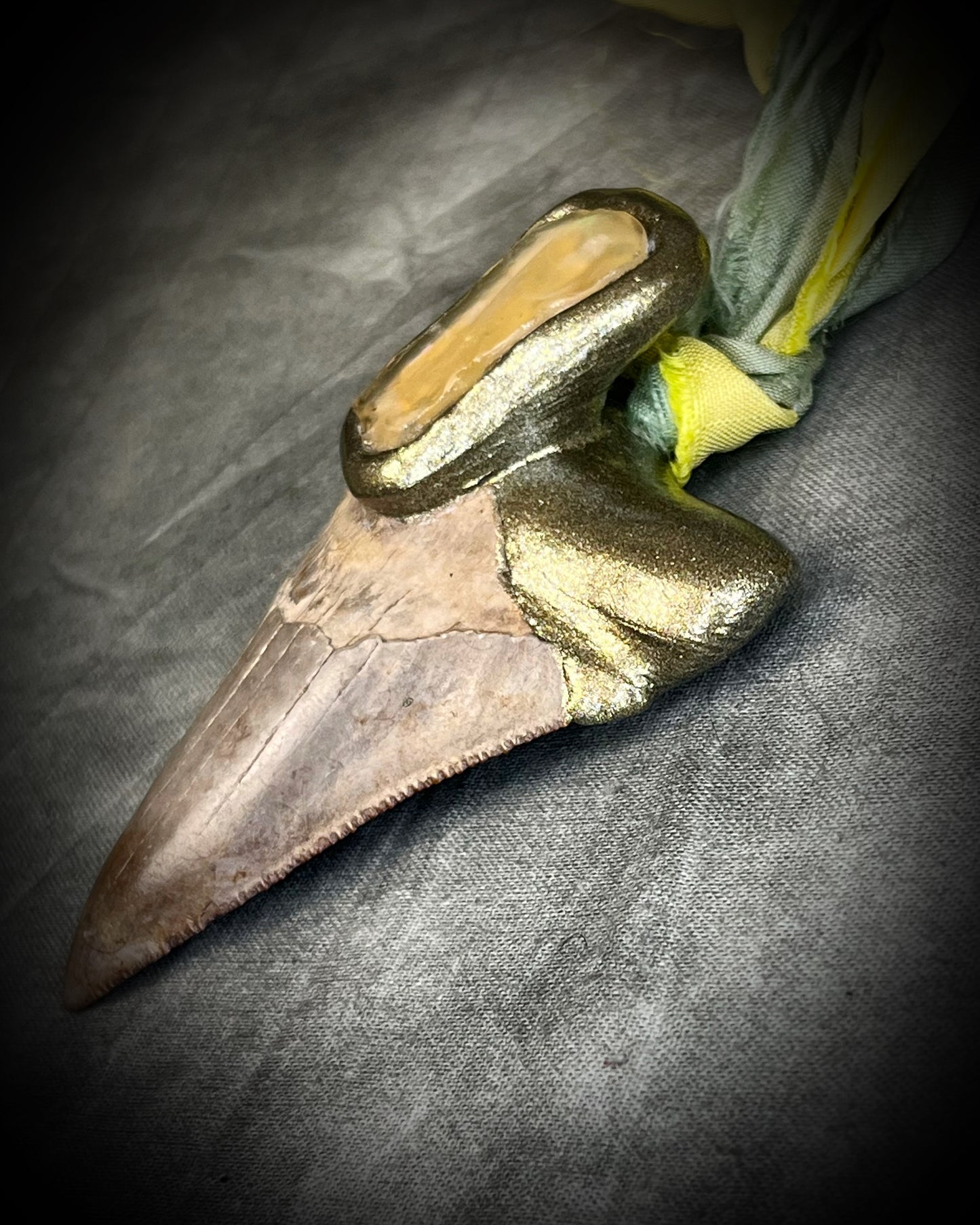Genuine Megalodon fossil shark tooth talisman with Libyan Desert Glass and mint green and yellow recycled silk ties by Become Spellbound, Baltimore Magazine Best of Baltimore 2026 Jewelry winner.