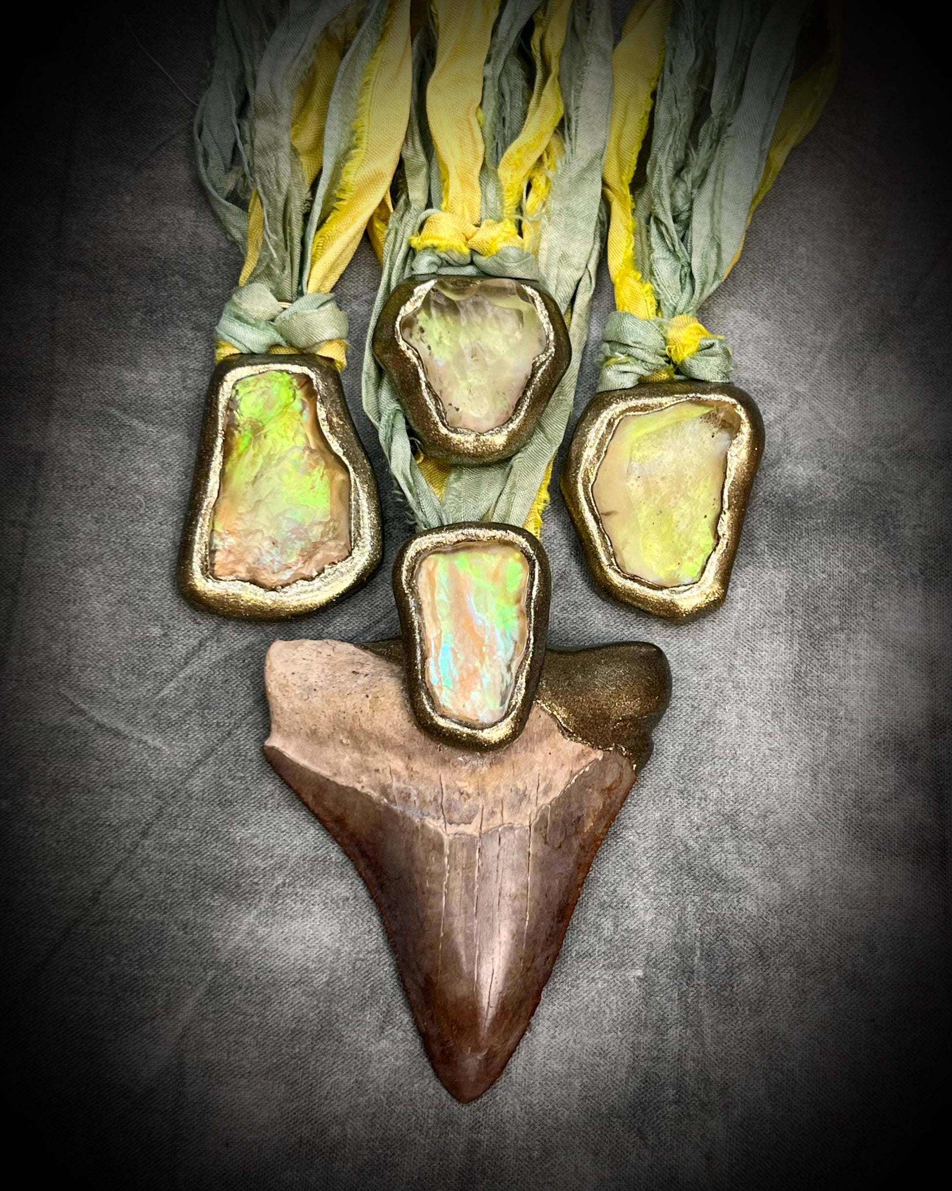 Genuine Megalodon fossil shark tooth talisman with Libyan Desert Glass and mint green and yellow recycled silk ties by Become Spellbound, Baltimore Magazine Best of Baltimore 2026 Jewelry winner.