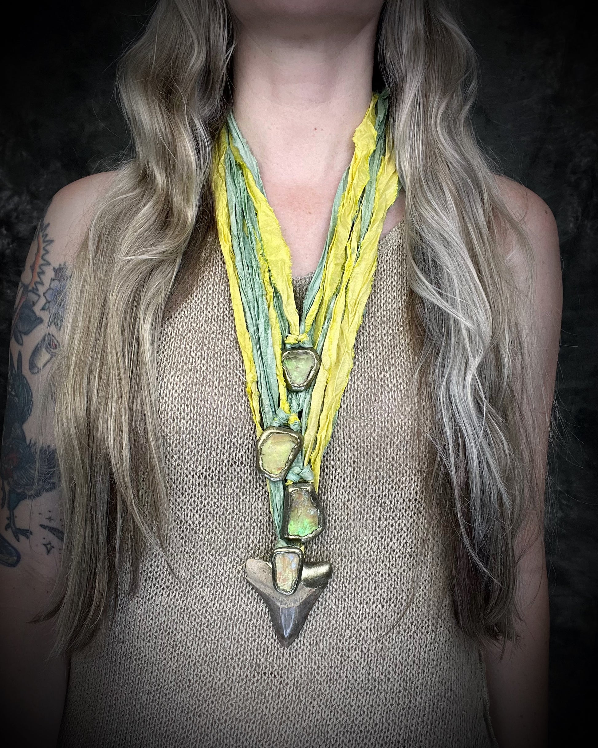 Genuine Megalodon fossil shark tooth talisman with Libyan Desert Glass and mint green and yellow recycled silk ties, layered here with more tektite pendants by Become Spellbound, Baltimore Magazine Best of Baltimore 2026 Jewelry winner.