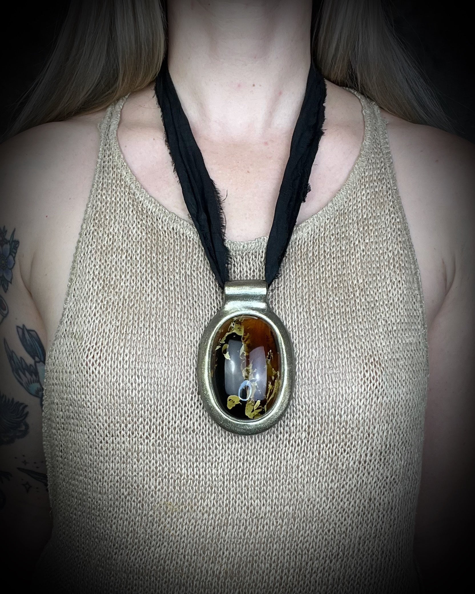 Glowing XXL Statement Necklace featuring a large Indonesian Amber gemstone with a gold setting, hung from black recycled silk. Maximalist holiday gift for her!