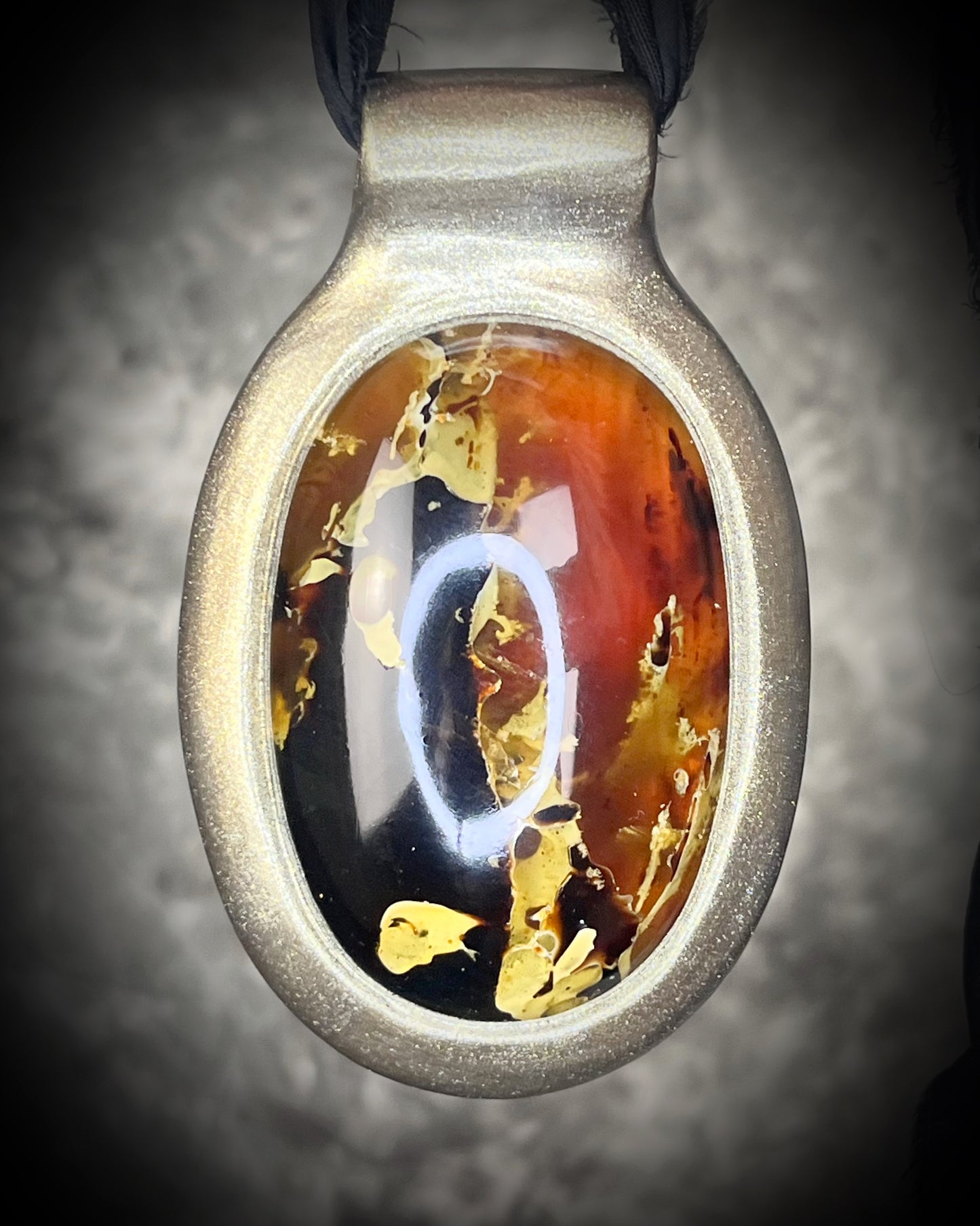 Glowing XXL Statement Necklace featuring a large Indonesian Amber gemstone with a gold setting, hung from black recycled silk. Maximalist holiday gift for her!