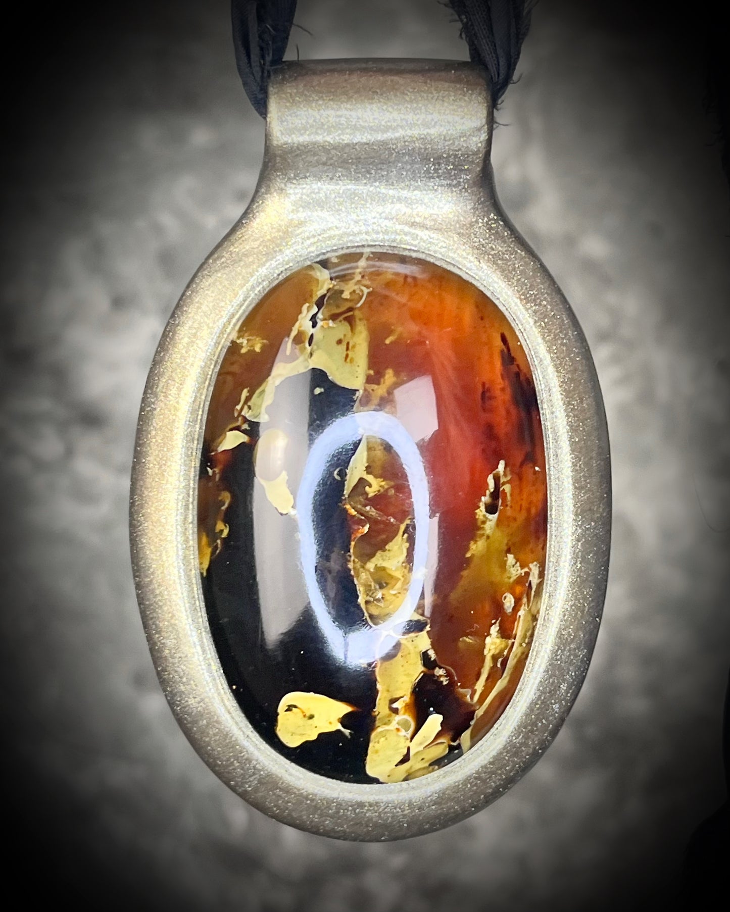 Glowing XXL Statement Necklace featuring a large Indonesian Amber gemstone with a gold setting, hung from black recycled silk. Maximalist holiday gift for her!