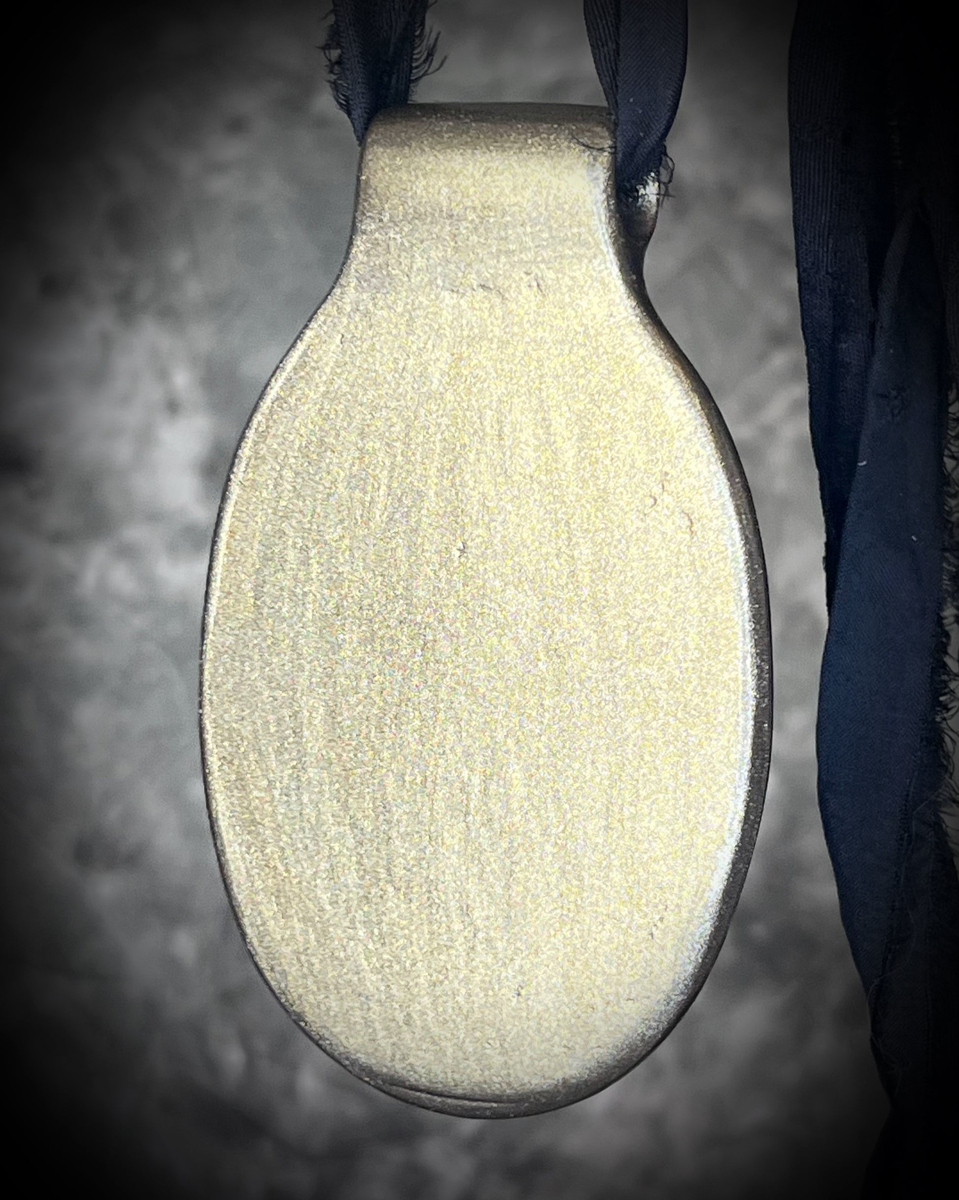 Glowing XXL Statement Necklace featuring a large Indonesian Amber gemstone with a gold setting, hung from black recycled silk. Maximalist holiday gift for her!