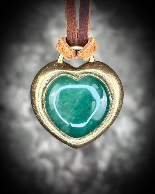 Green Aventurine crystal heart necklace on brown leather. Jewelry for luck, abundance, valentine's day and everyday magic!