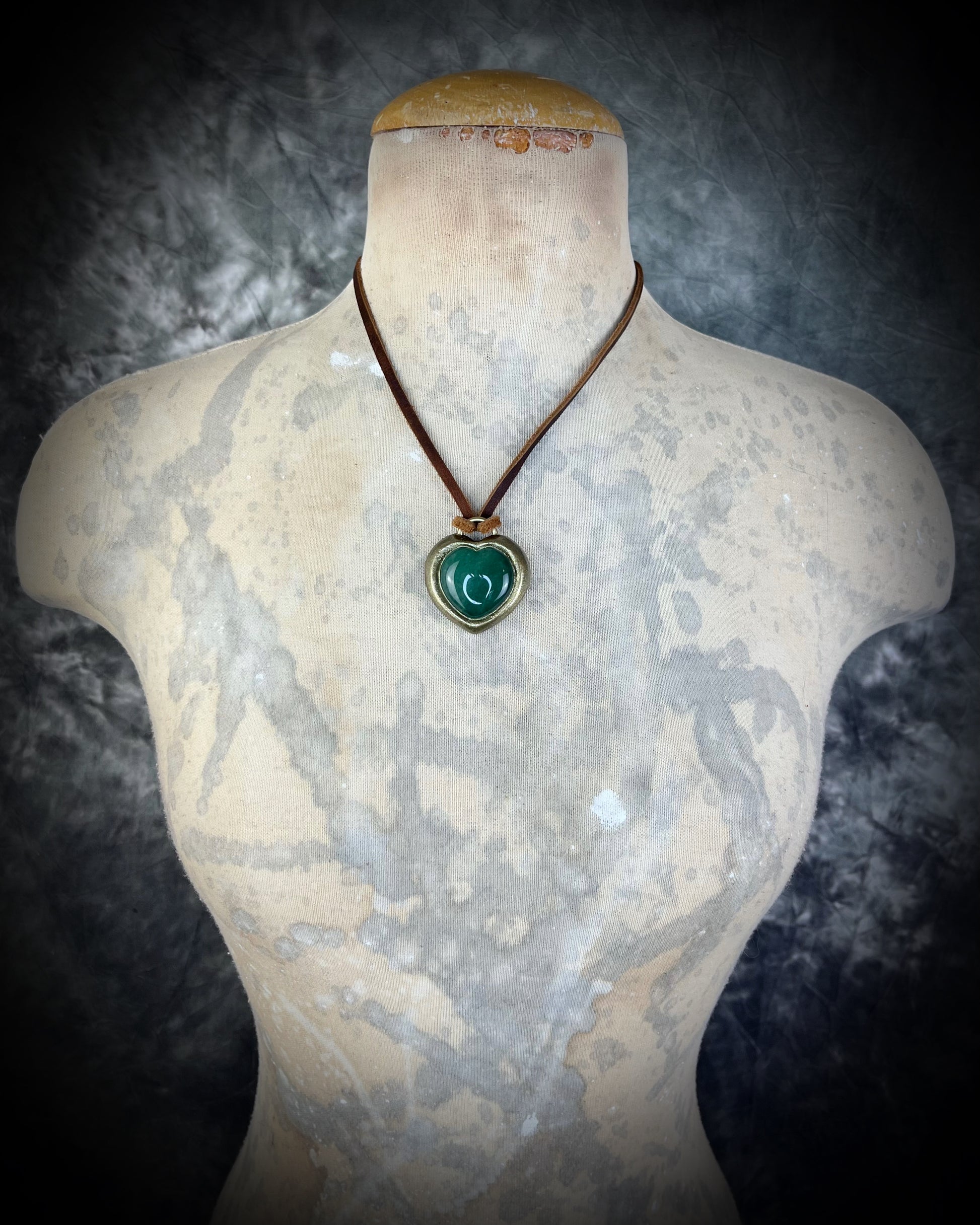 Green Aventurine crystal heart necklace on brown leather. Jewelry for luck, abundance, valentine's day and everyday magic!