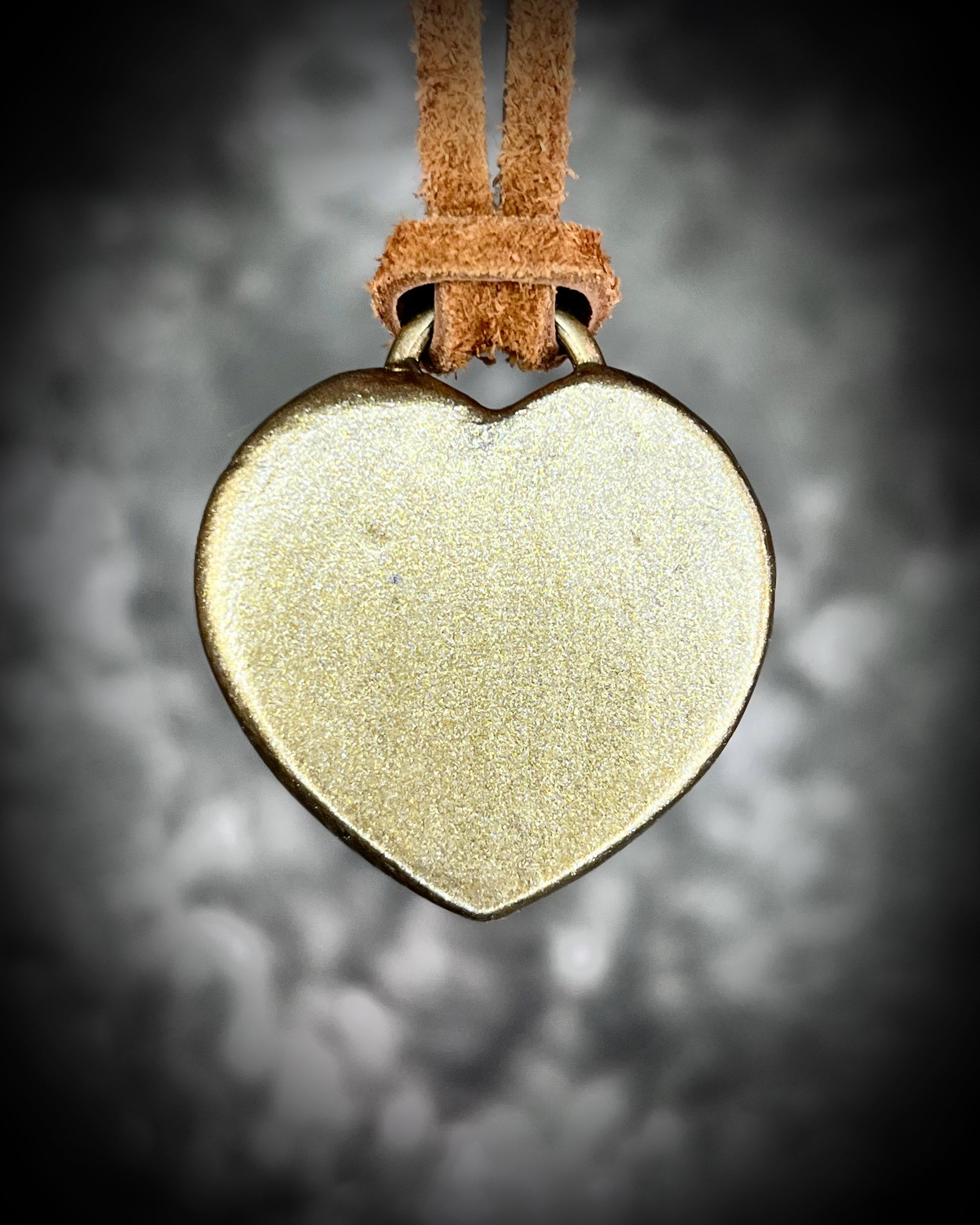 Green Aventurine crystal heart necklace on brown leather. Jewelry for luck, abundance, valentine's day and everyday magic!