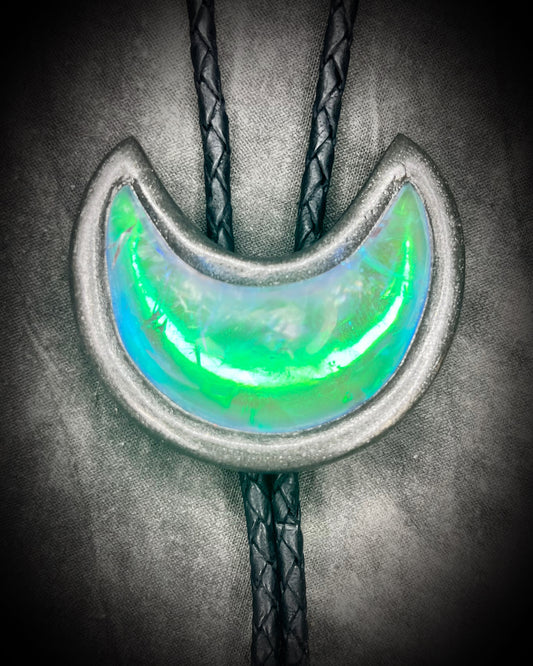 Green opal quartz crescent moon bolo tie in a gunmetal silver finish with matching spike tips, styled as a mystical unisex crystal