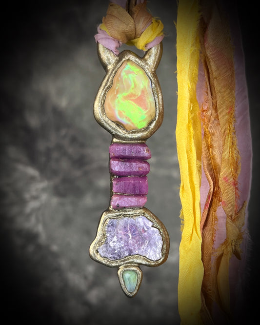 Handcrafted Libyan Desert Glass, Ruby, Lepidolite and Green Tourmaline Museum grade talisman pendant hung from recycled silks in a gold sculptural finish. 