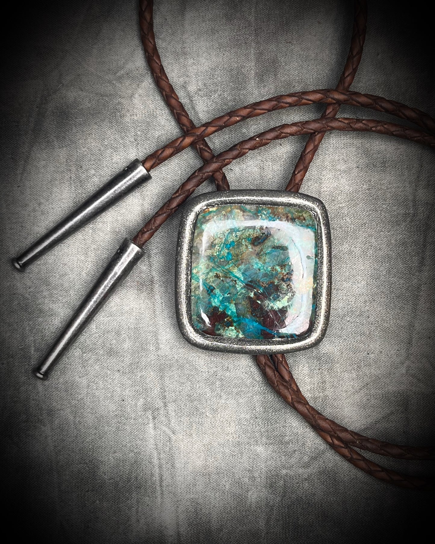 Handmade Chrysocolla Bolo Tie in Silver Finish with Silver Tips on Brown Braided Leather. Artisan modern bolo tie gift for him. 
