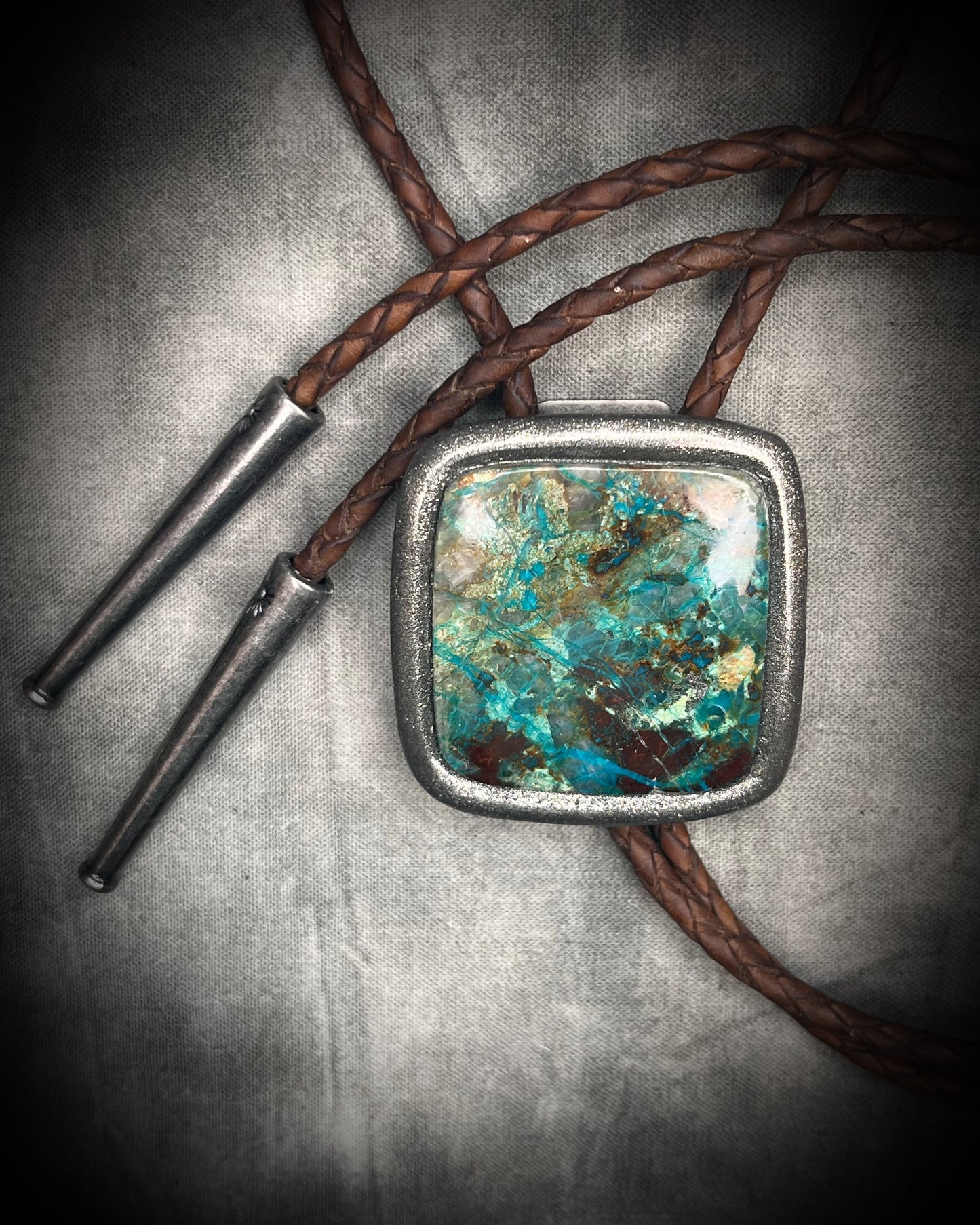 Handmade Chrysocolla Bolo Tie in Silver Finish with Silver Tips on Brown Braided Leather. Artisan modern bolo tie gift for him. 