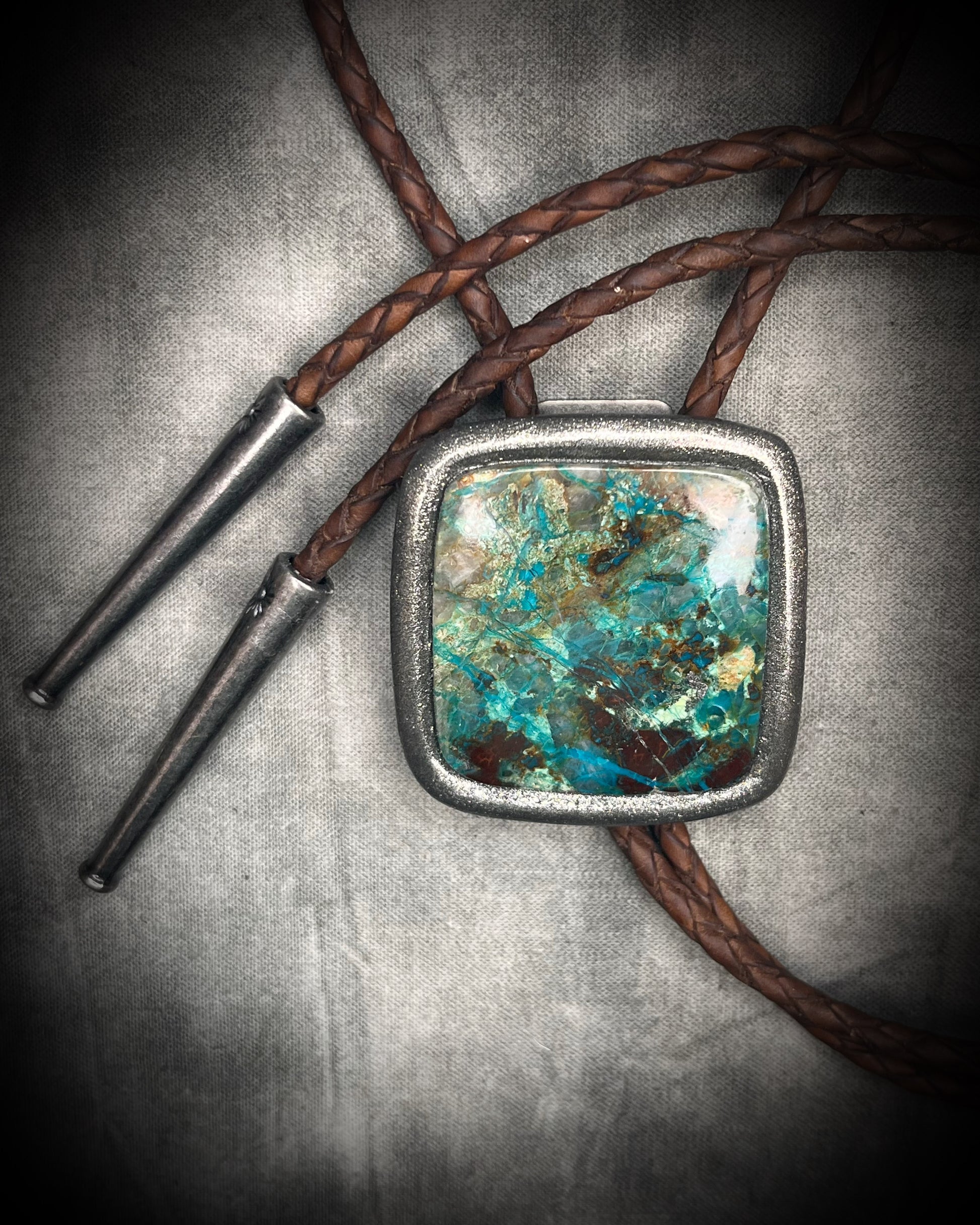 Handmade Chrysocolla Bolo Tie in Silver Finish with Silver Tips on Brown Braided Leather. Artisan modern bolo tie gift for him. 