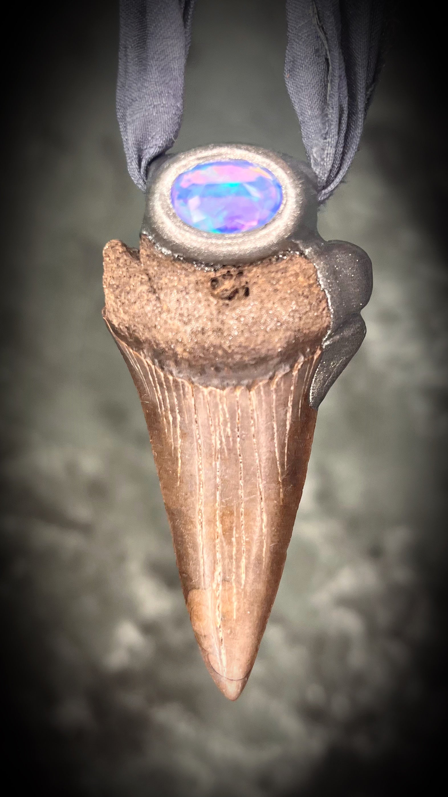 Handmade Ethereal and Powerful Mako shark tooth and opal fossil pendant on grey recycled silk. 