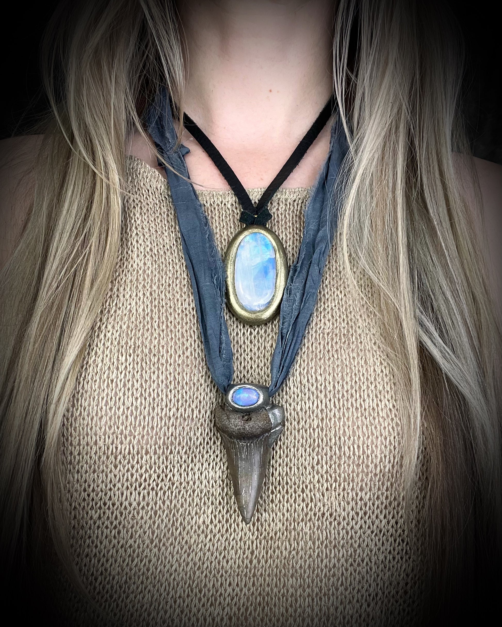 Handmade Ethereal and Powerful Mako shark tooth and opal fossil pendant on grey recycled silk.  Shown here layered with a rainbow moonstone necklace.