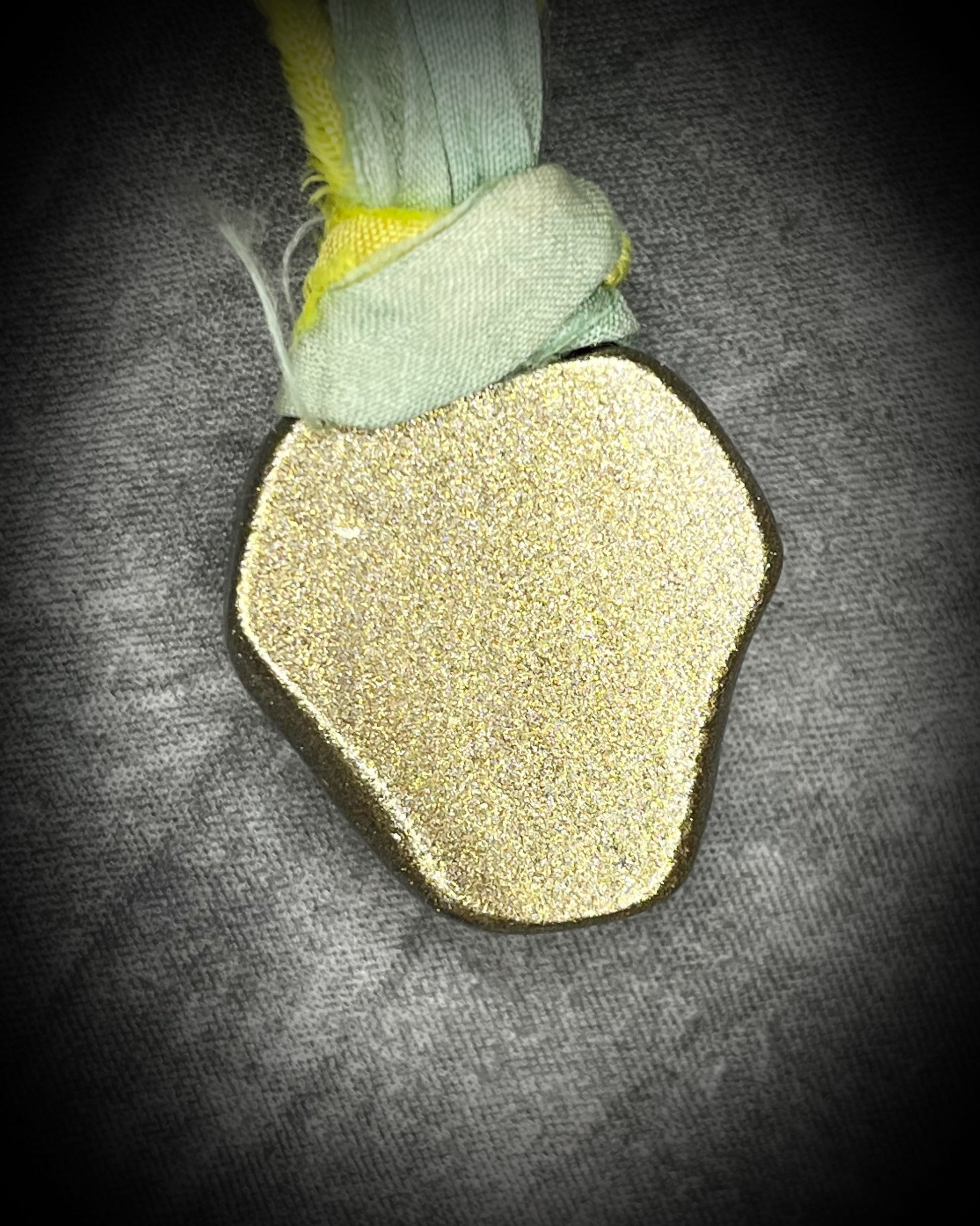 Handmade Libyan Desert Glass necklaces with luminous shifting flashes of green, gold, peach, and rose on sea green and yellow recycled silk by Become Spellbound.