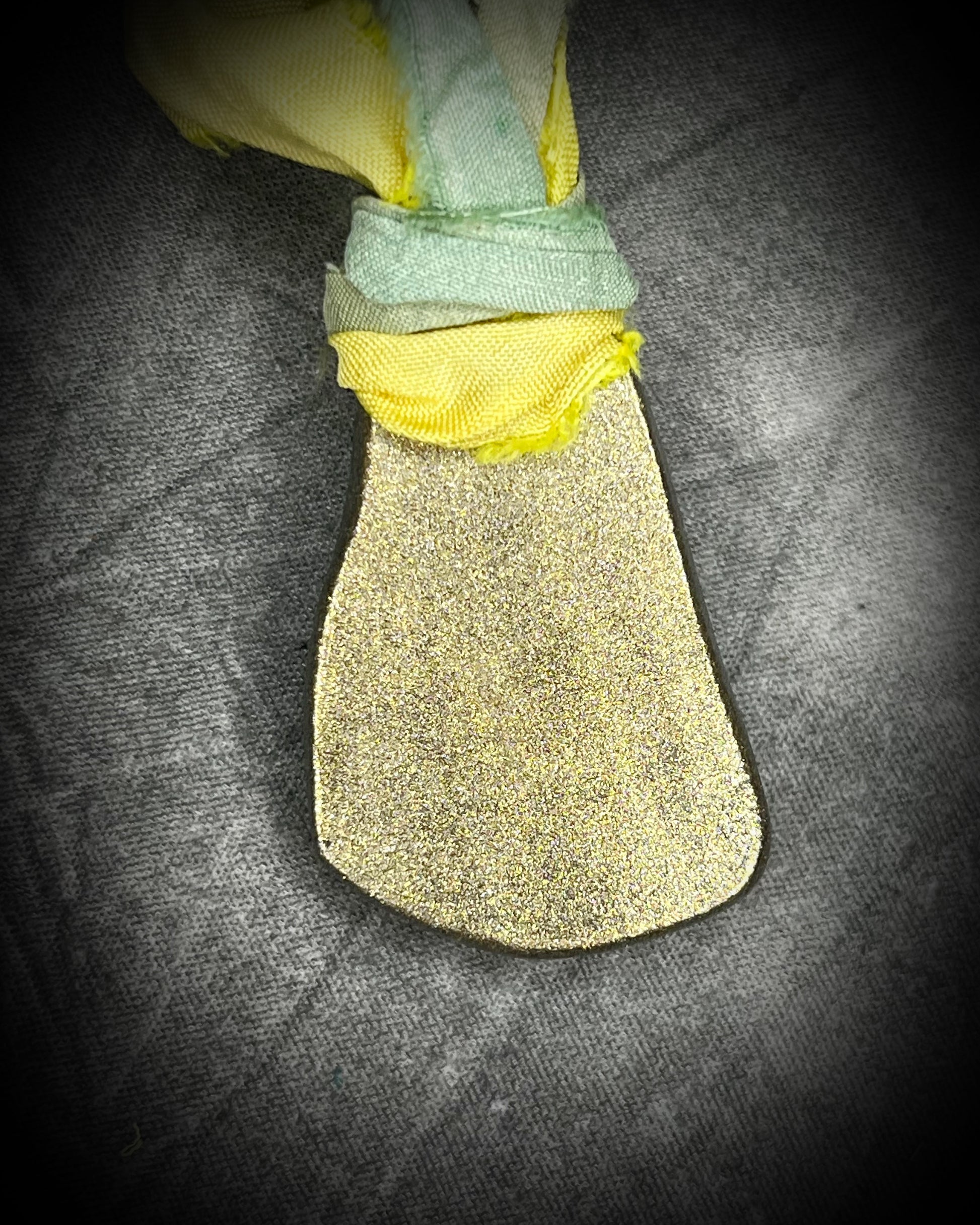 Handmade Libyan Desert Glass necklaces with luminous shifting flashes of green, gold, peach, and rose on sea green and yellow recycled silk by Become Spellbound.