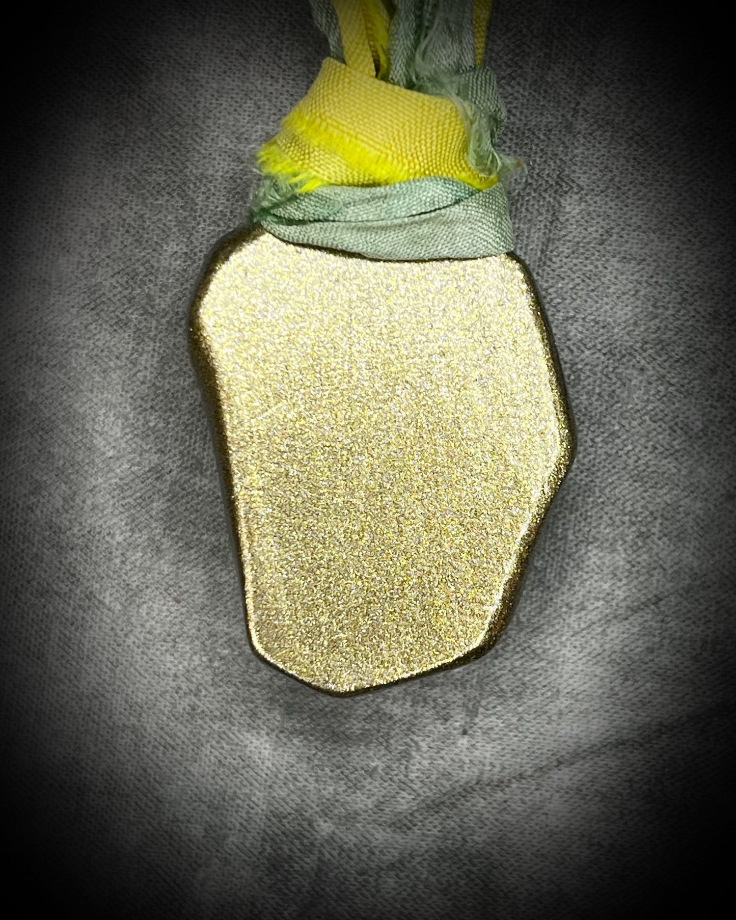Handmade Libyan Desert Glass necklaces with luminous shifting flashes of green, gold, peach, and rose on sea green and yellow recycled silk by Become Spellbound.