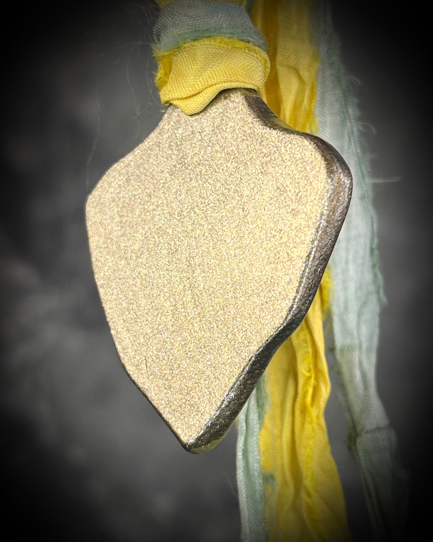 Handmade Libyan Desert Glass necklaces with luminous shifting flashes of green, gold, peach, and rose on sea green and yellow recycled silk by Become Spellbound.