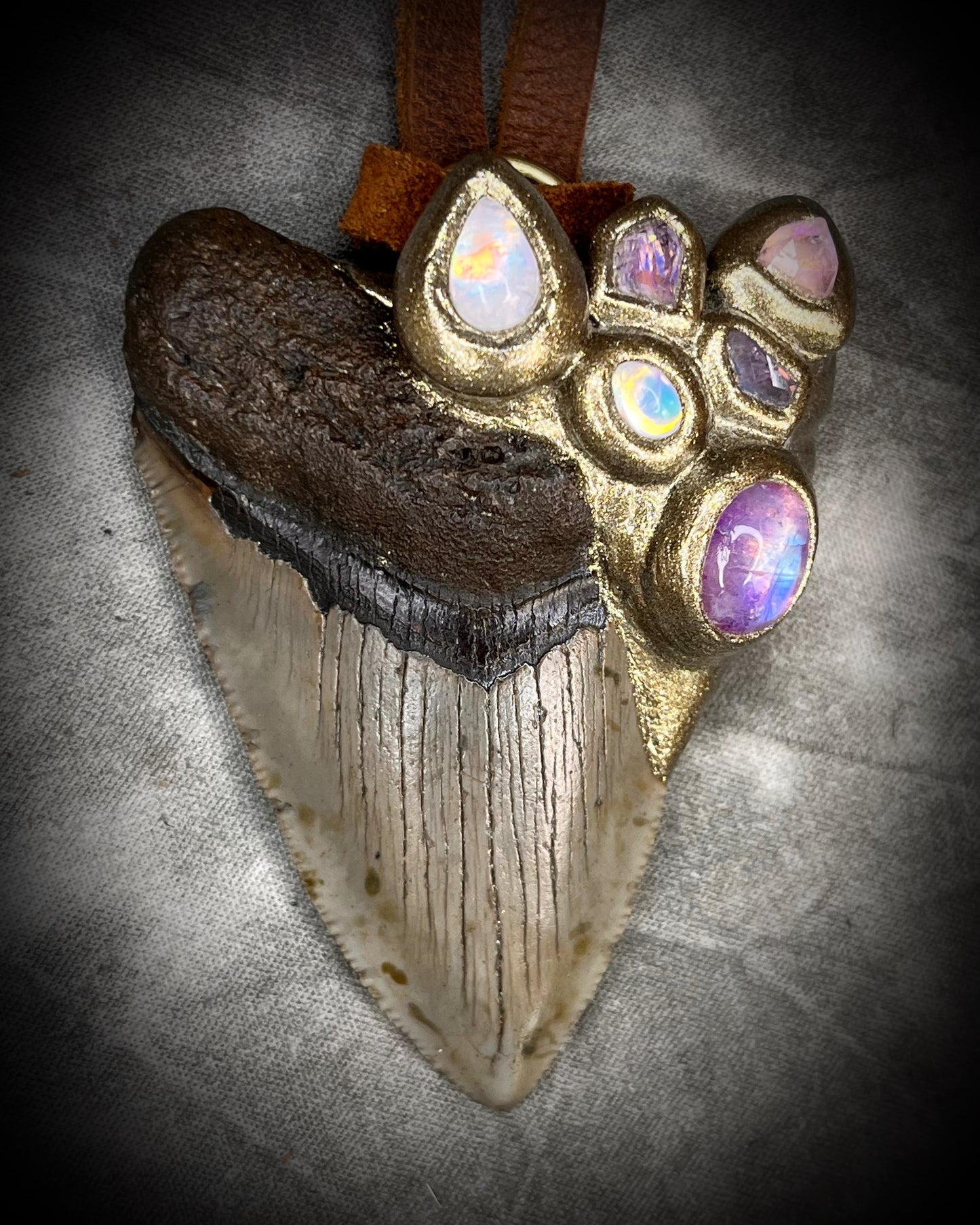 Handmade Megalodon Fossil Shark Tooth Talisman with Moonstone, Spinel, Tourmaline gemstones, hung from brown Leather for earthy elegance.