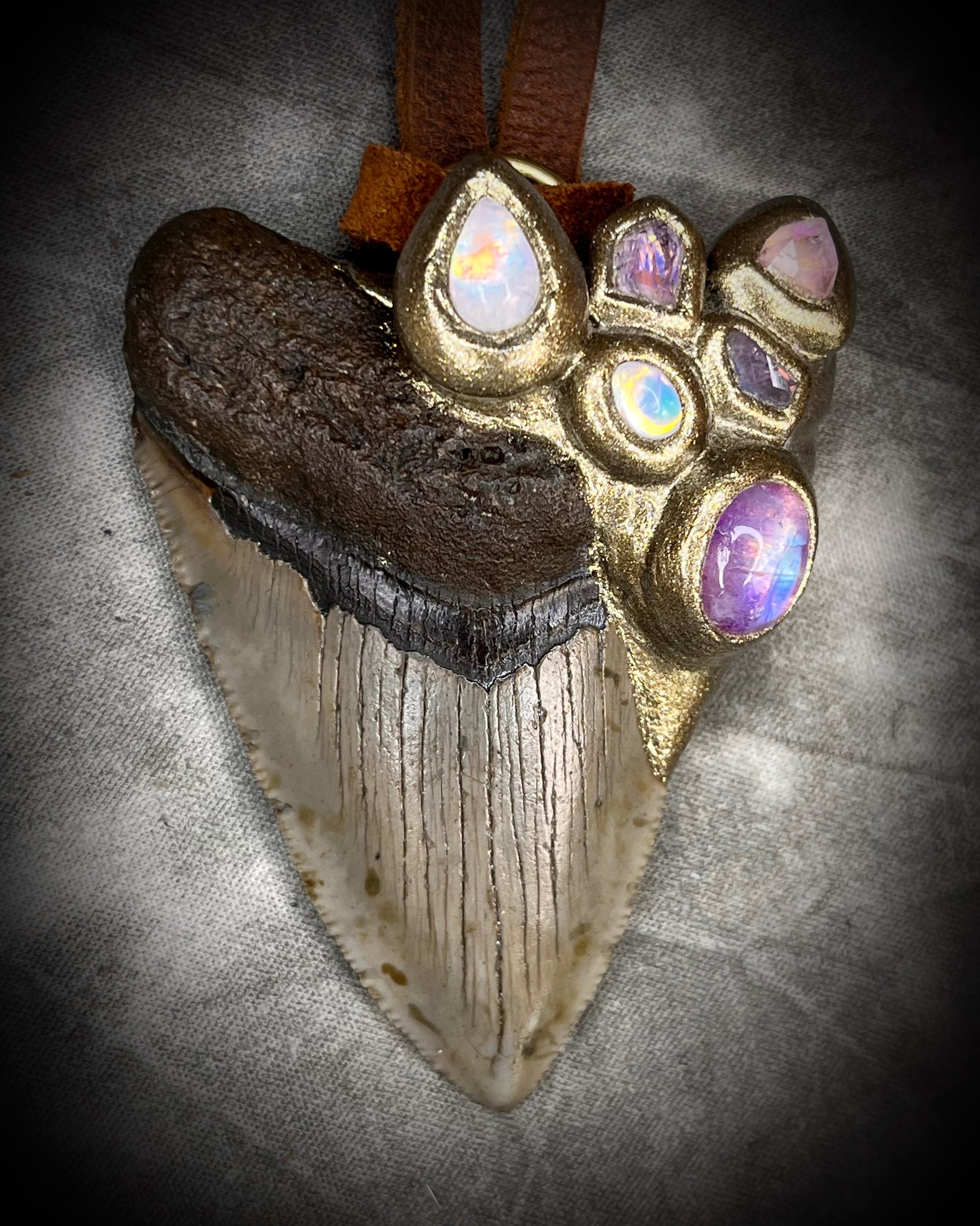 Handmade Megalodon Fossil Shark Tooth Talisman with Moonstone, Spinel, Tourmaline gemstones, hung from brown Leather for earthy elegance.