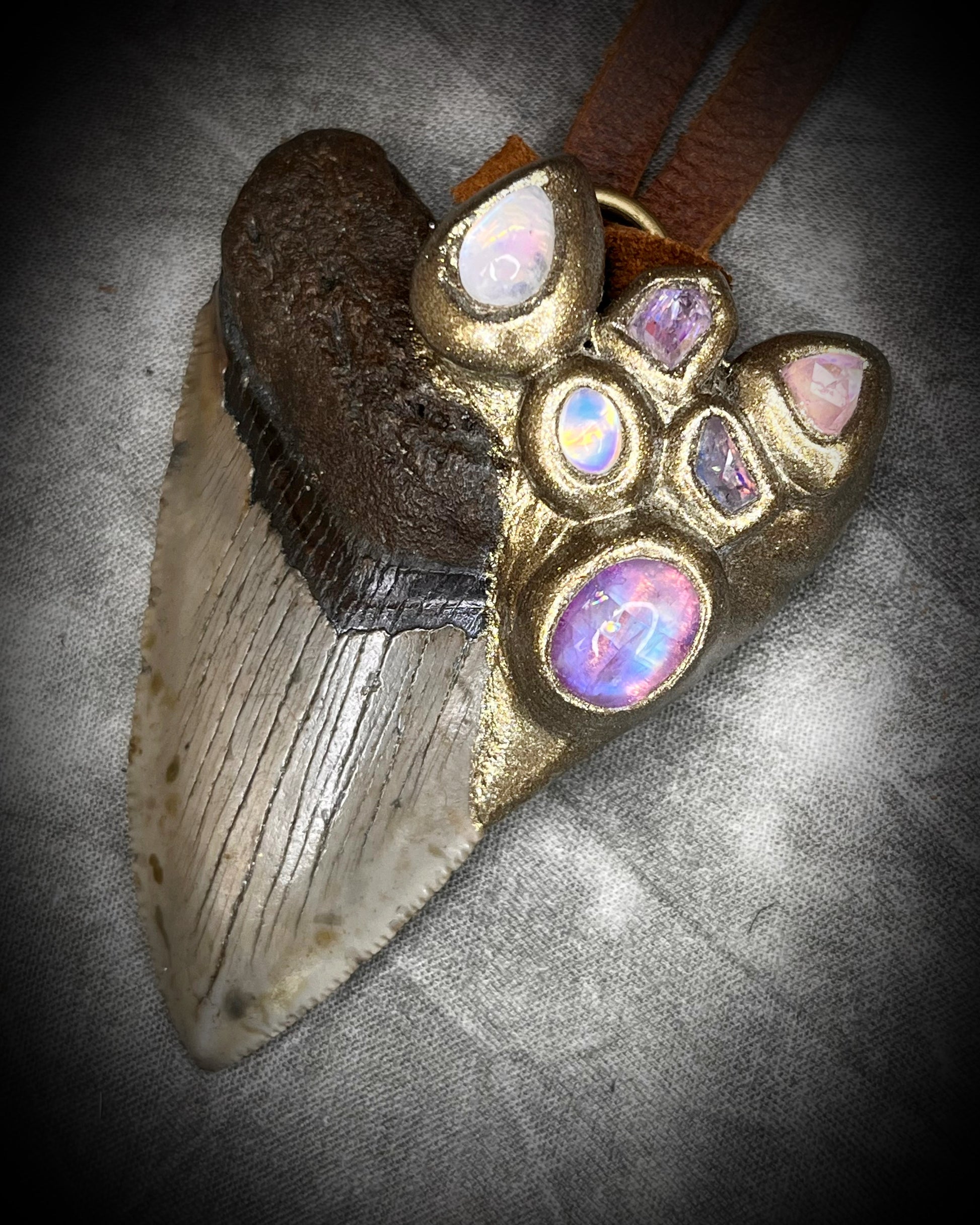 Handmade Megalodon Fossil Shark Tooth Talisman with Moonstone, Spinel, Tourmaline gemstones, hung from brown Leather for earthy elegance.