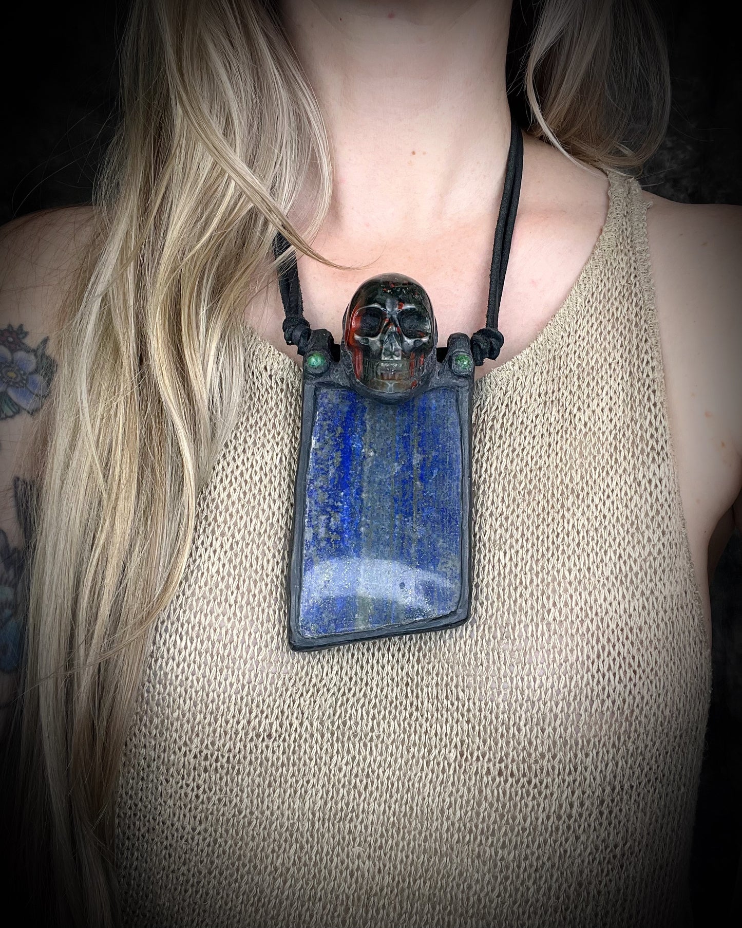 Handmade XL lapis lazuli slab necklace with bloodstone crystal skull, chrysocolla accents, black leather, handmade wire clasp, and bead detail by Anothai Hansen.