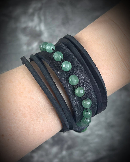 Handmade black leather cuff bracelet with green aventurine beads, chrysocolla accents, layered leather, and adjustable leather tie closure by Anothai Hansen.