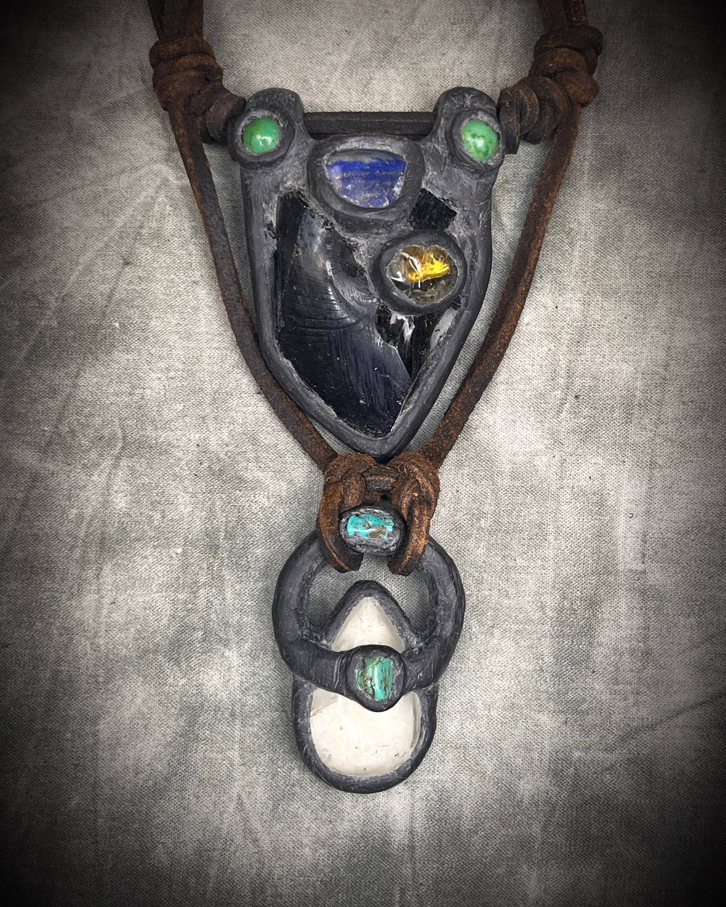 Handmade double strand crystal necklace with obsidian, lapis lazuli, citrine, chrysocolla, quartz, turquoise, black and brown leather, and handmade wire clasp by Anothai Hansen.