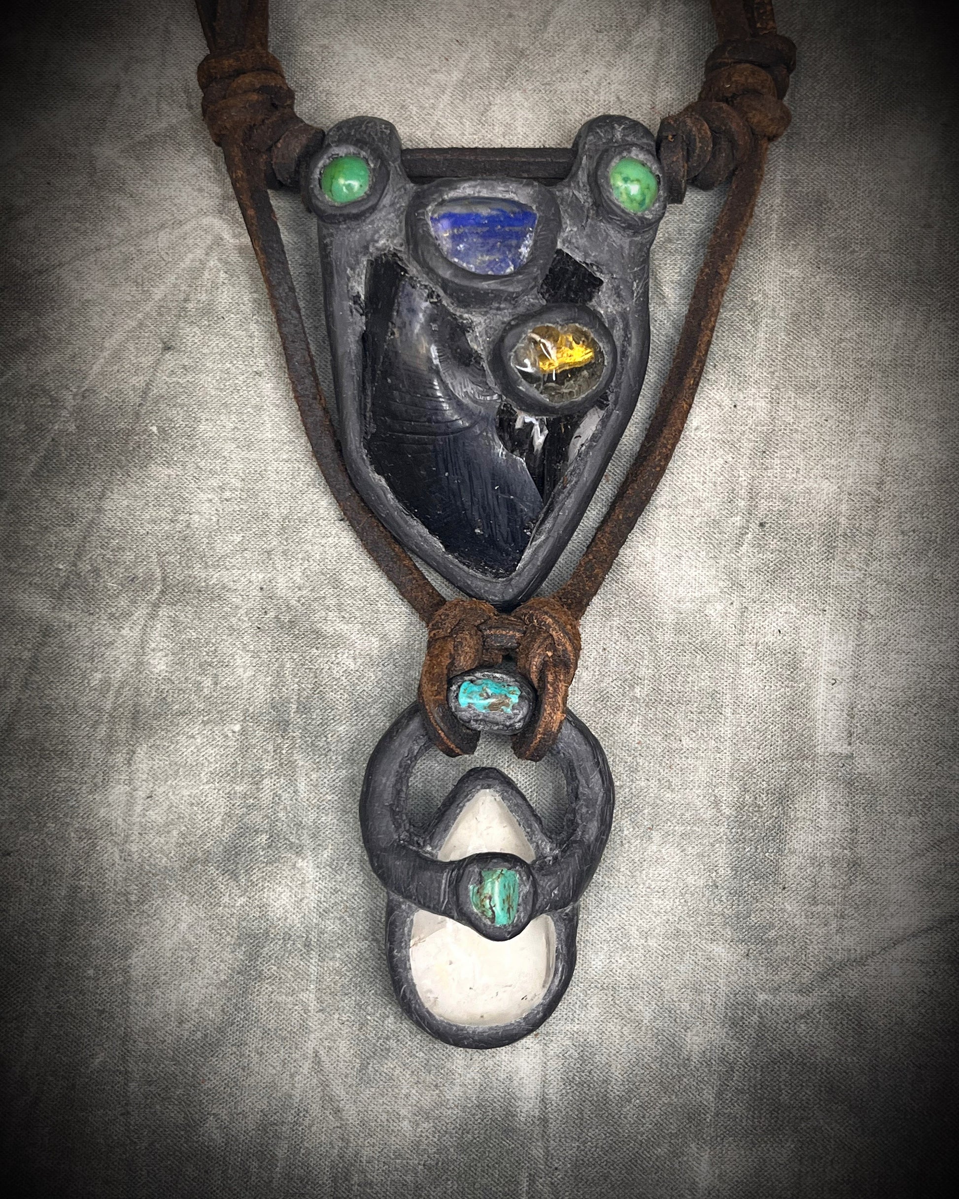 Handmade double strand crystal necklace with obsidian, lapis lazuli, citrine, chrysocolla, quartz, turquoise, black and brown leather, and handmade wire clasp by Anothai Hansen.