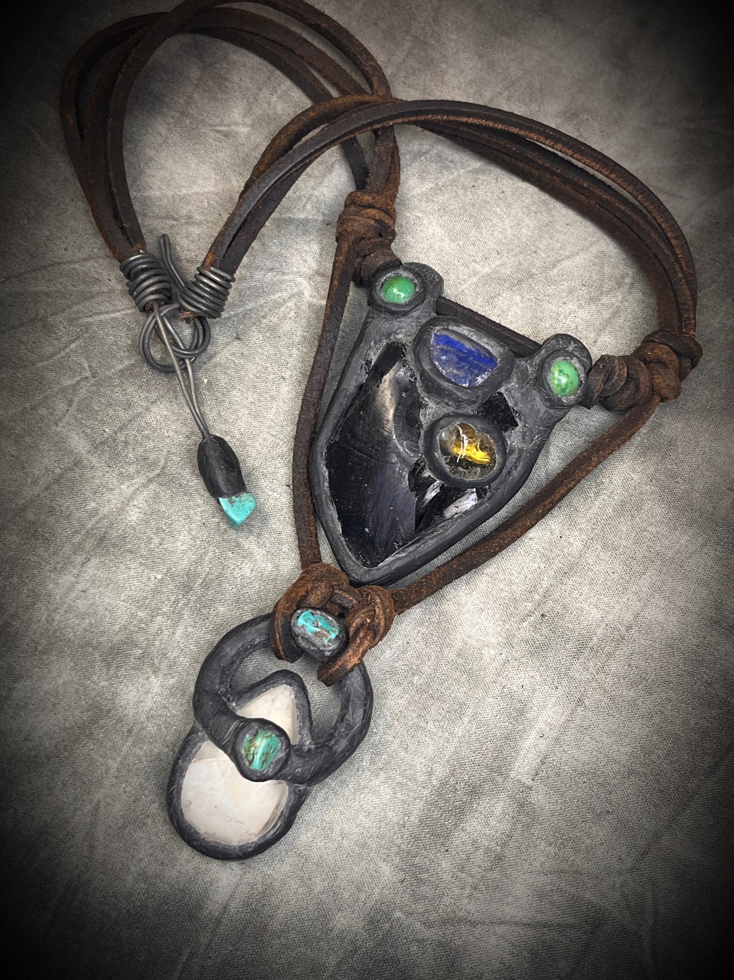 Handmade double strand crystal necklace with obsidian, lapis lazuli, citrine, chrysocolla, quartz, turquoise, black and brown leather, and handmade wire clasp by Anothai Hansen.