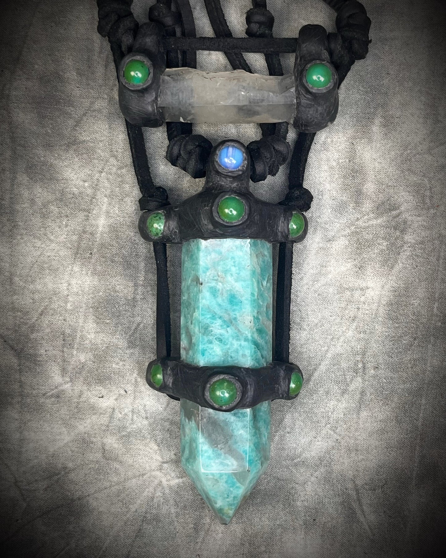 Handmade leather crystal necklace with XL amazonite point, quartz, chrysocolla, opalite, and handmade wire clasp by Anothai Hansen.