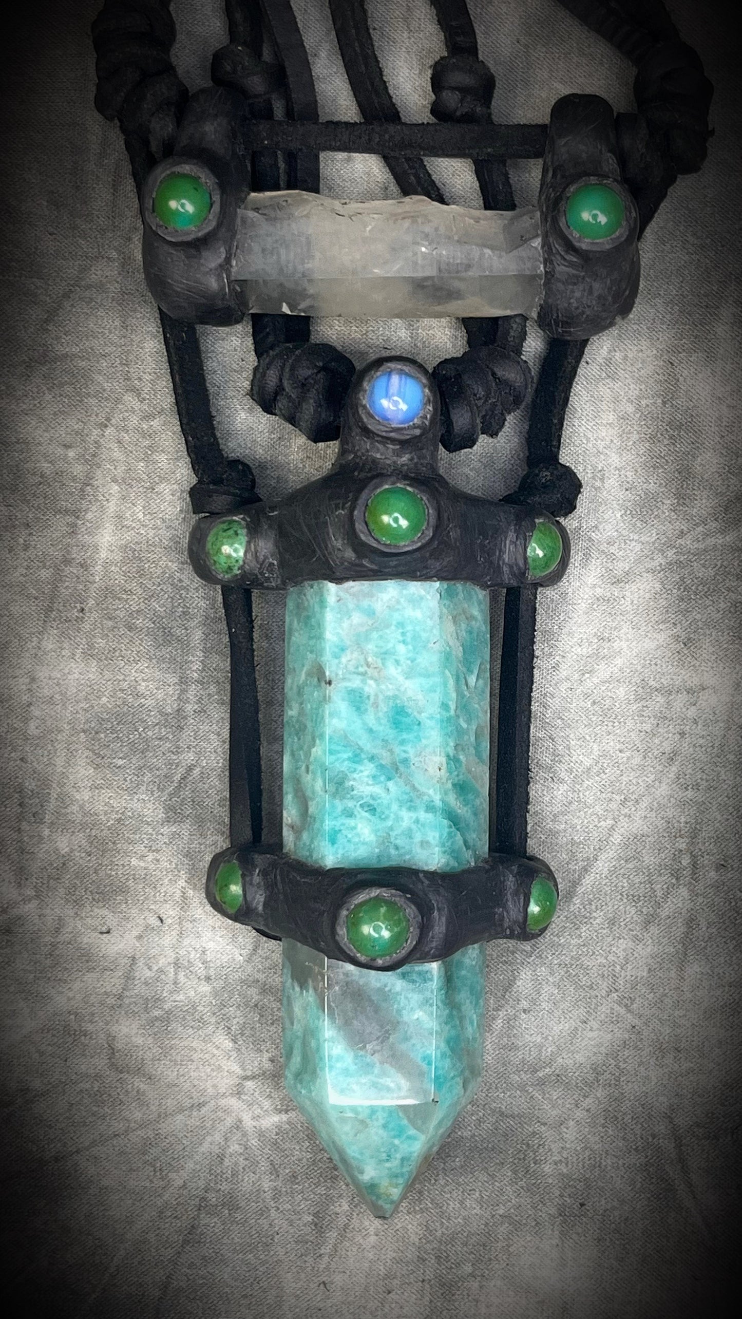 Handmade leather crystal necklace with XL amazonite point, quartz, chrysocolla, opalite, and handmade wire clasp by Anothai Hansen.