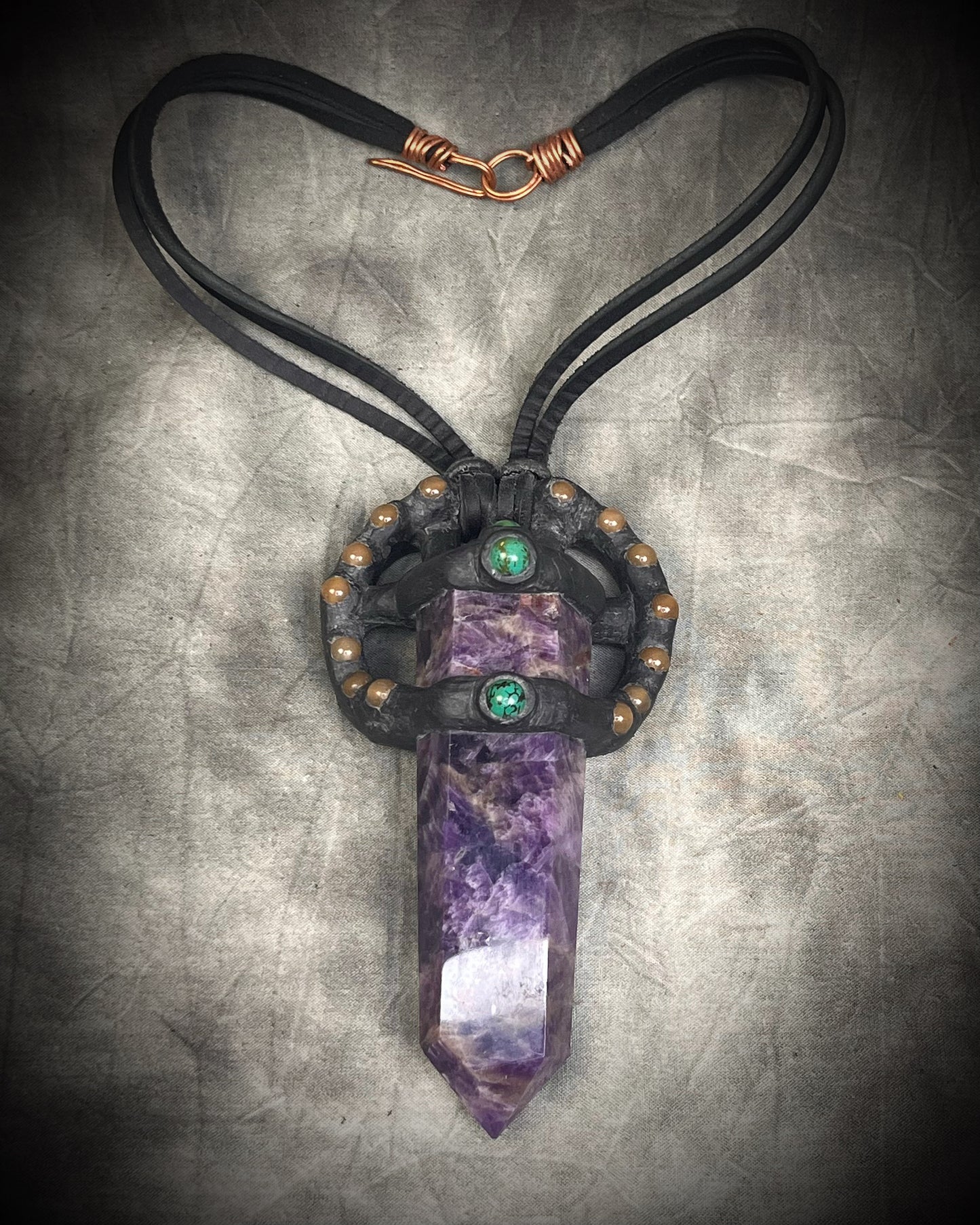 Handmade leather crystal necklace with XL amethyst point, honey jade, green chrysocolla, and handmade wire clasp by Anothai Hansen.