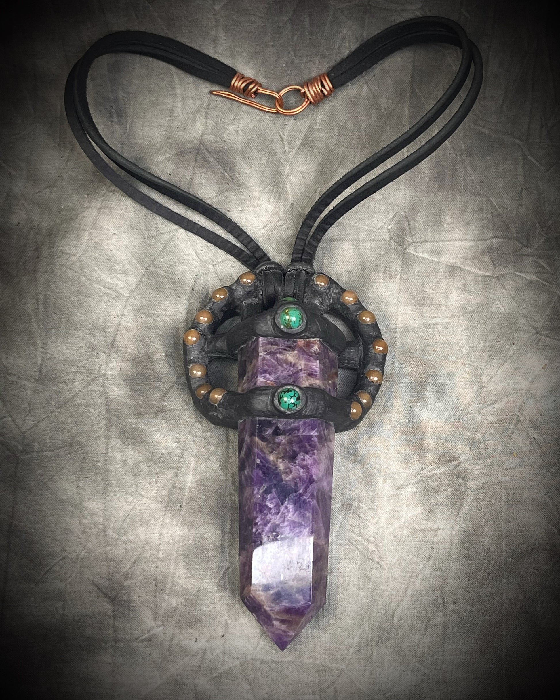 Handmade leather crystal necklace with XL amethyst point, honey jade, green chrysocolla, and handmade wire clasp by Anothai Hansen.
