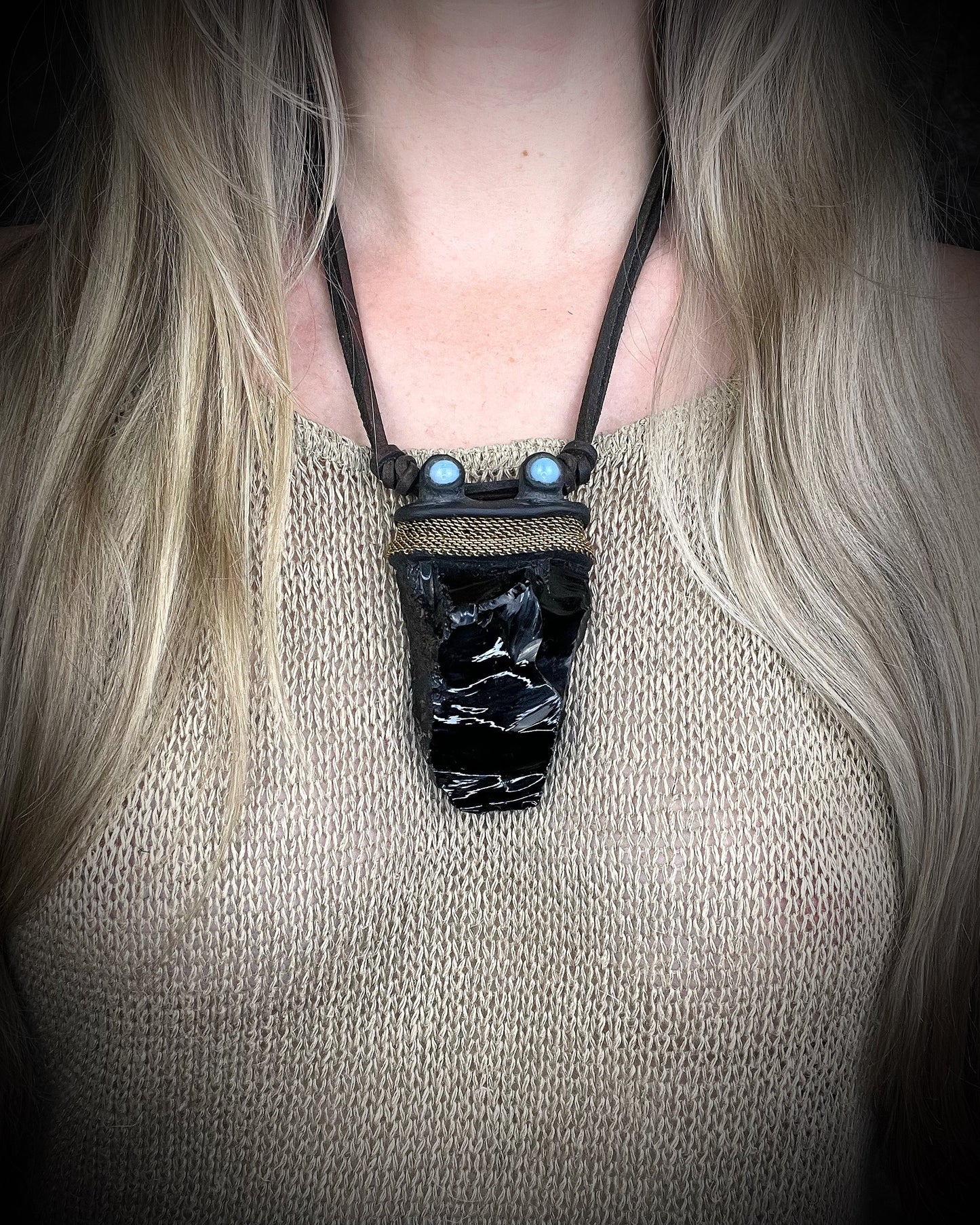 Handmade leather crystal necklace with raw obsidian, opalite crystals, metal chain detail, and handmade wire clasp by Anothai Hansen.