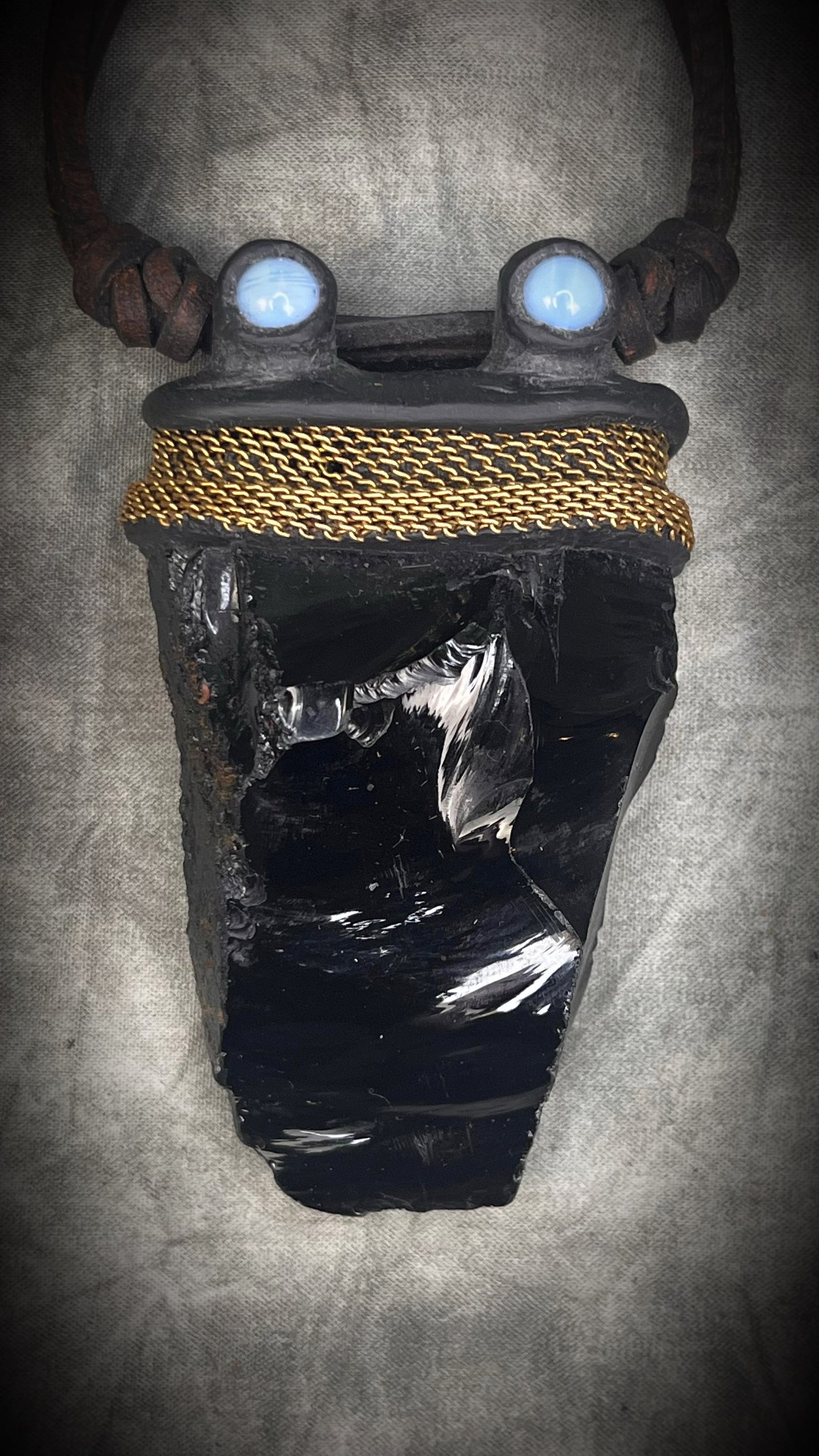 Handmade leather crystal necklace with raw obsidian, opalite crystals, metal chain detail, and handmade wire clasp by Anothai Hansen.