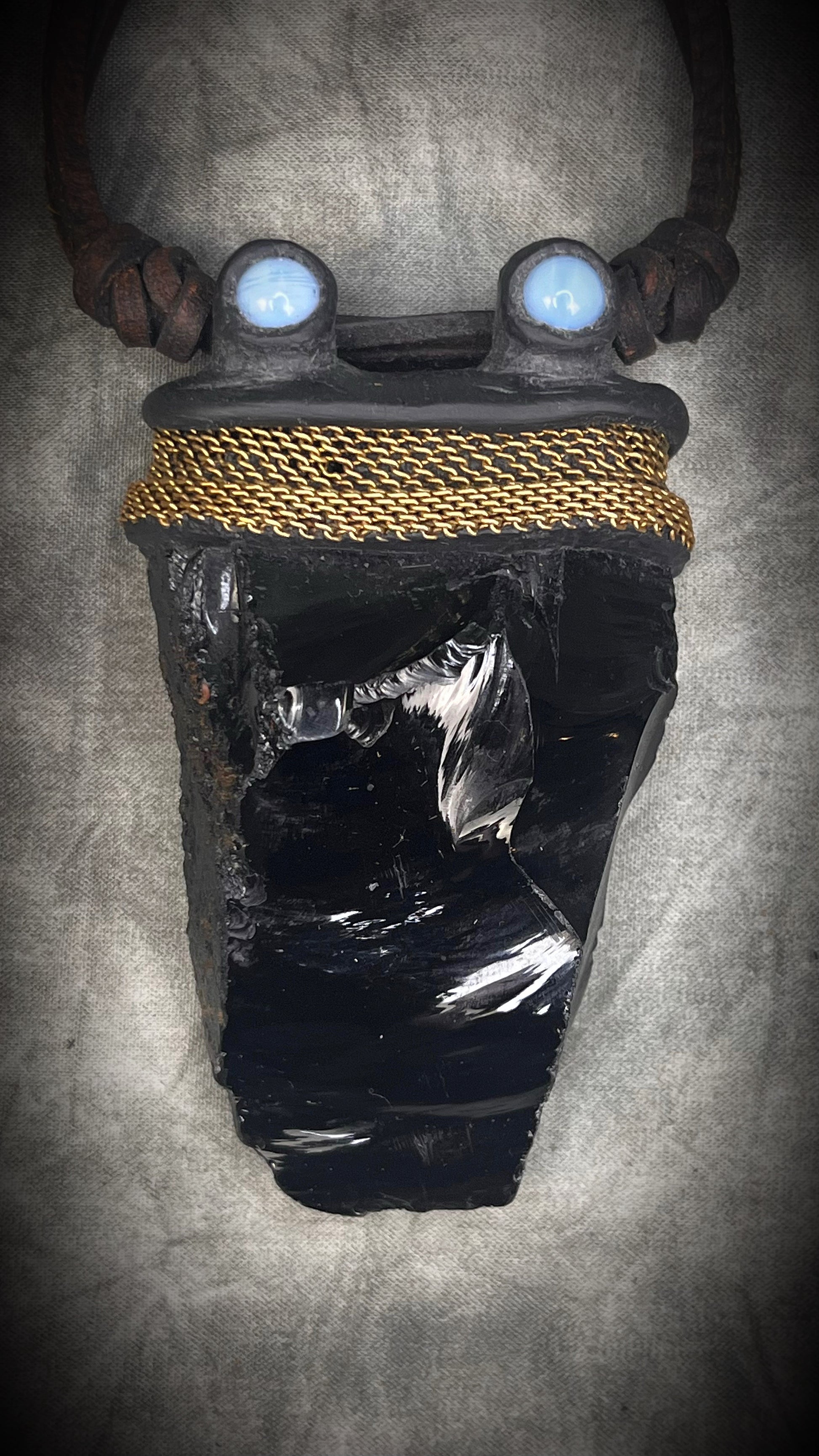 Handmade leather crystal necklace with raw obsidian, opalite crystals, metal chain detail, and handmade wire clasp by Anothai Hansen.