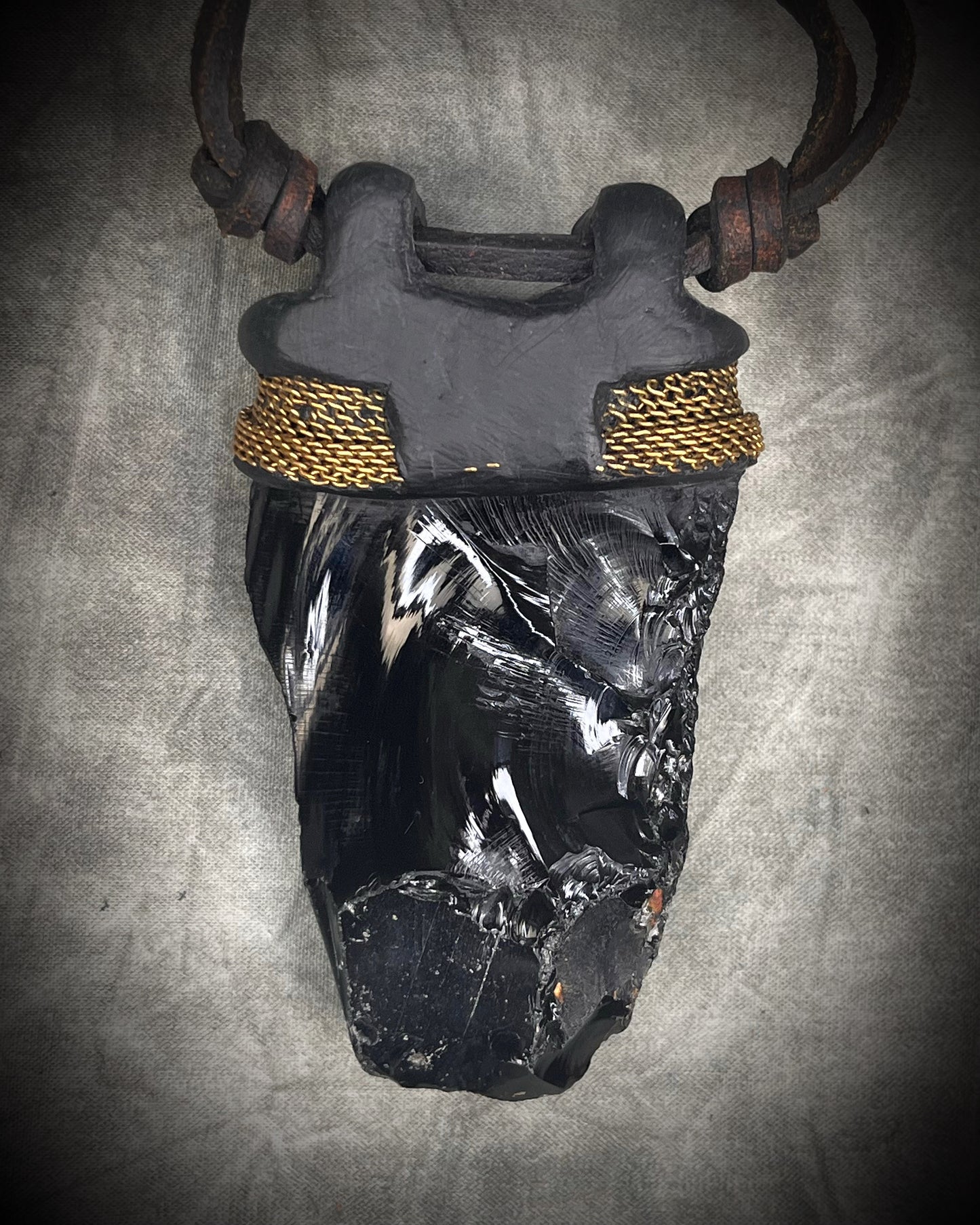 Handmade leather crystal necklace with raw obsidian, opalite crystals, metal chain detail, and handmade wire clasp by Anothai Hansen.