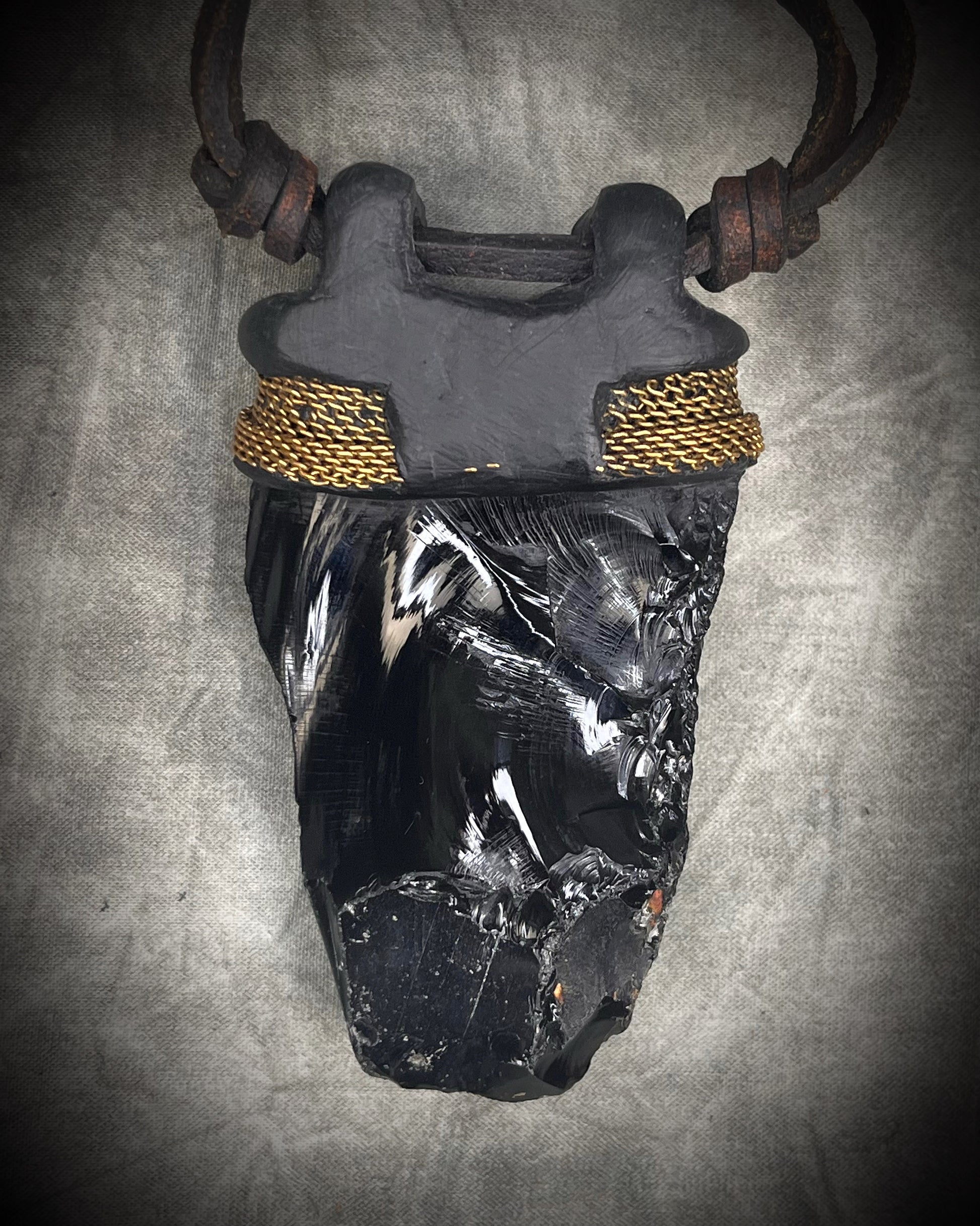 Handmade leather crystal necklace with raw obsidian, opalite crystals, metal chain detail, and handmade wire clasp by Anothai Hansen.