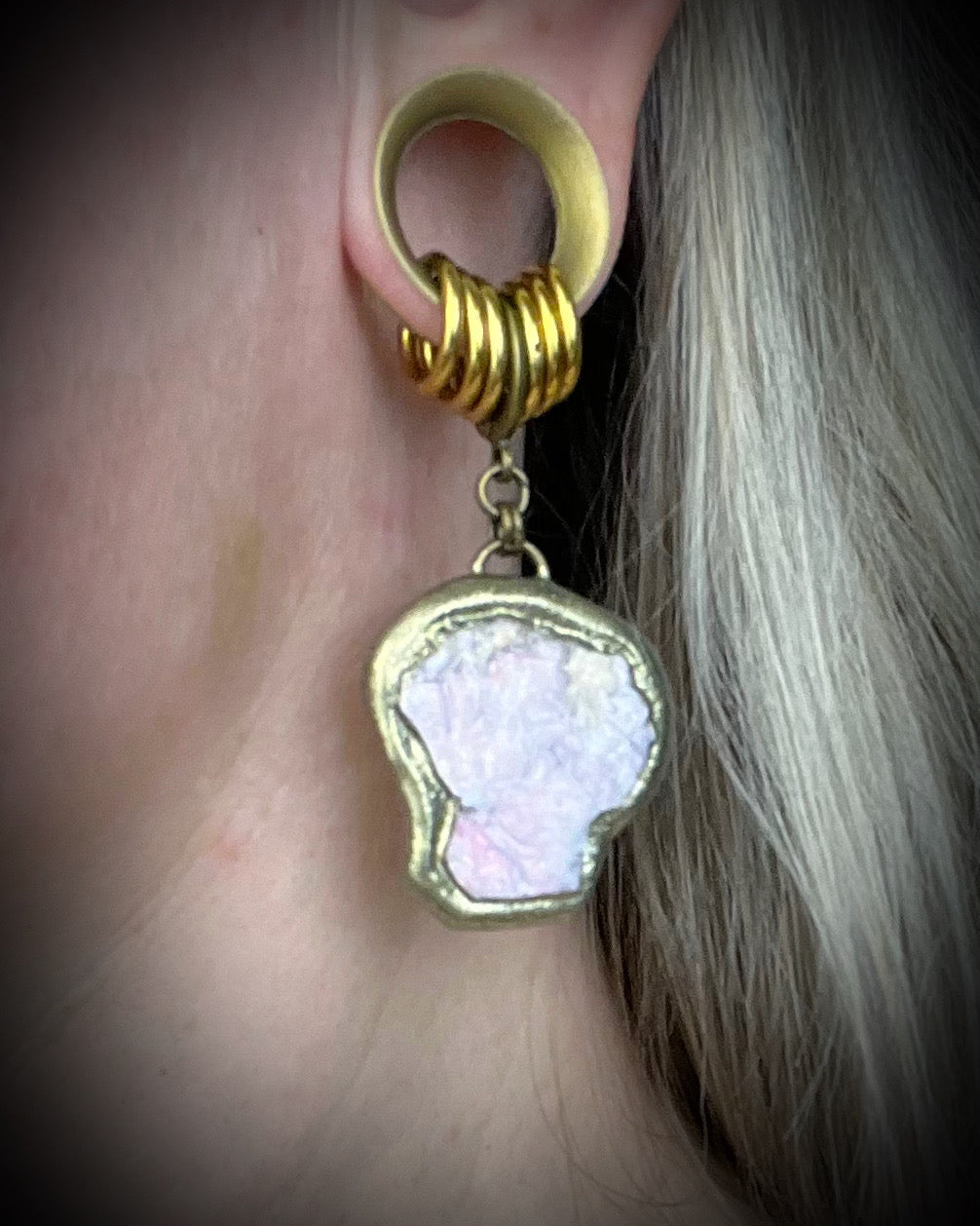 Handmade lepidolite crystal earrings with soft purple gemstone stones on gold finish hypoallergenic brass huggie hooks, created by Baltimore crystal jewelry artist Become Spellbound.
